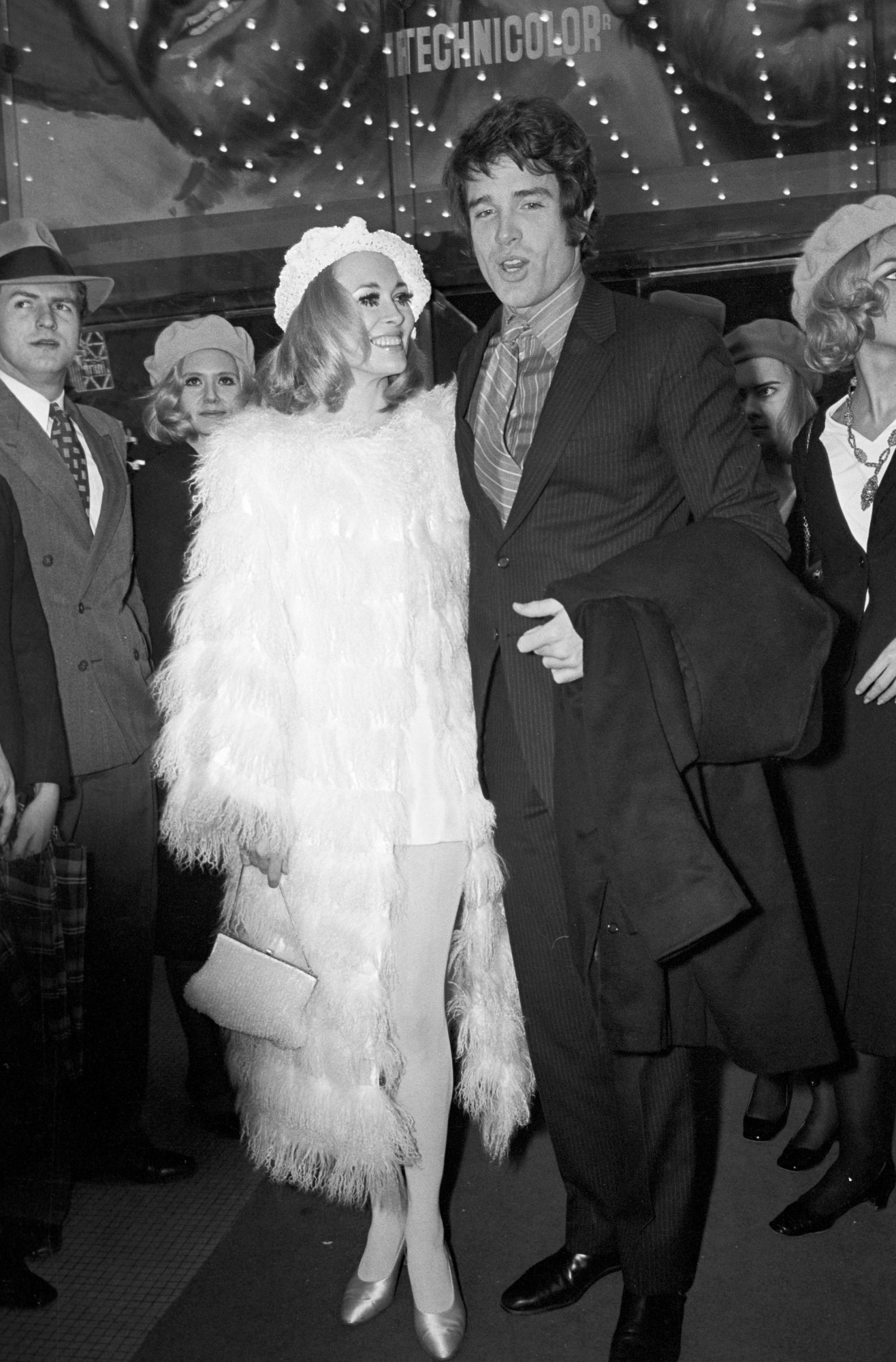 faye dunaway wearing a white feather trimmed coat at the premiere of bonnie & clyde in paris 1968