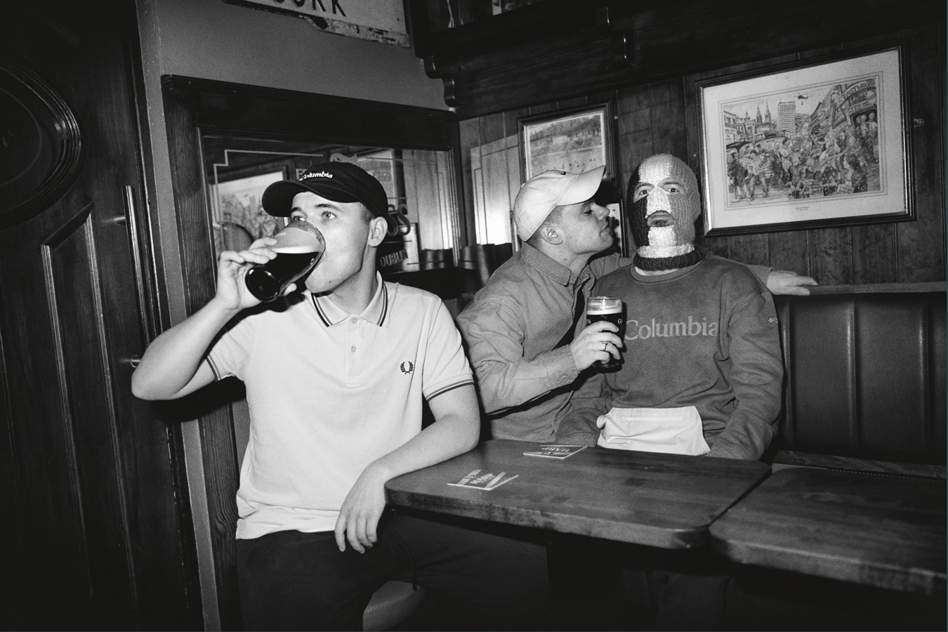 Photo of Kneecap drinking pints of beer in a pub in i-D 367 The Out of Body Issue