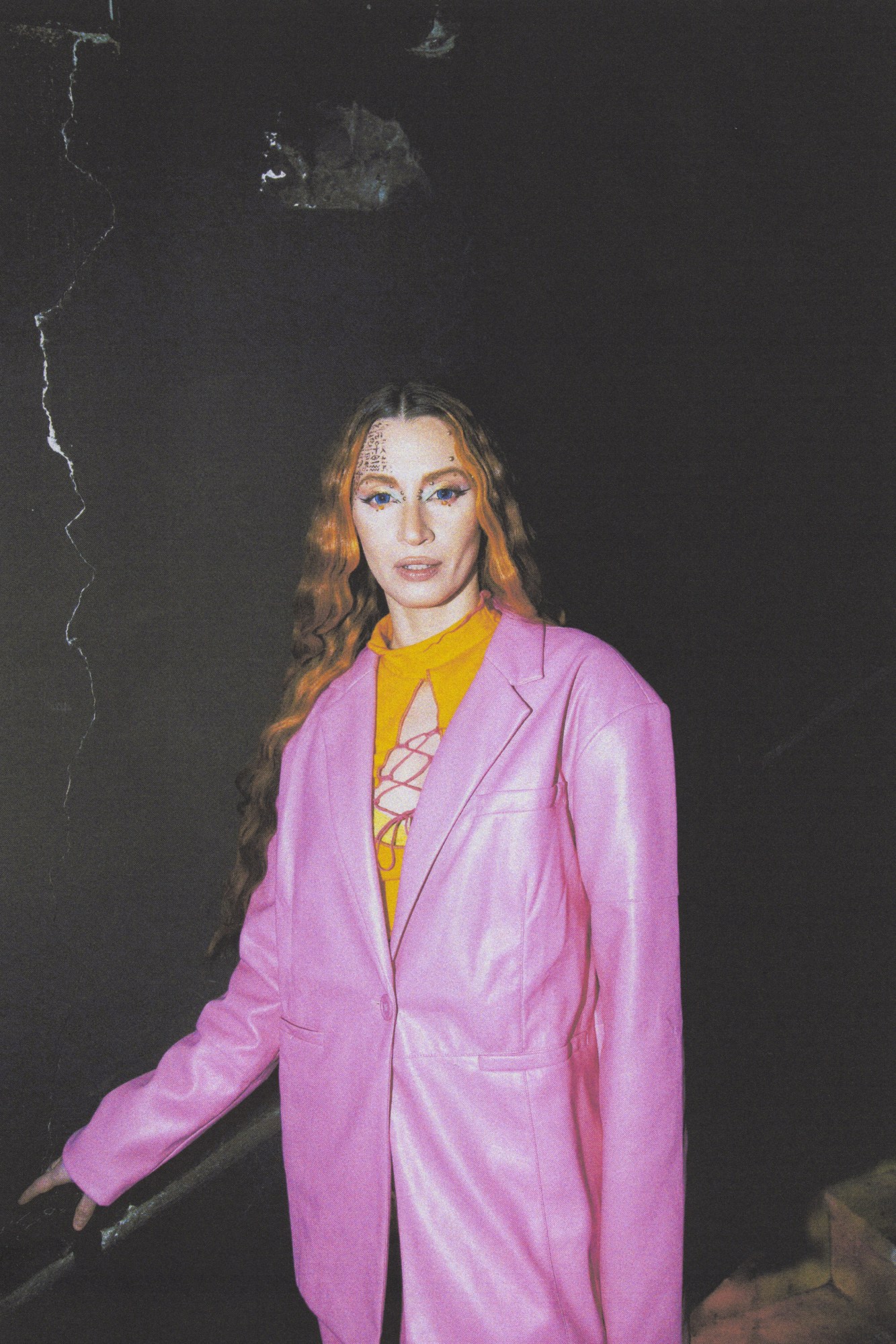 Napoli ballroom scene portrait of somebody with long orange hair wearing a pink leather coat