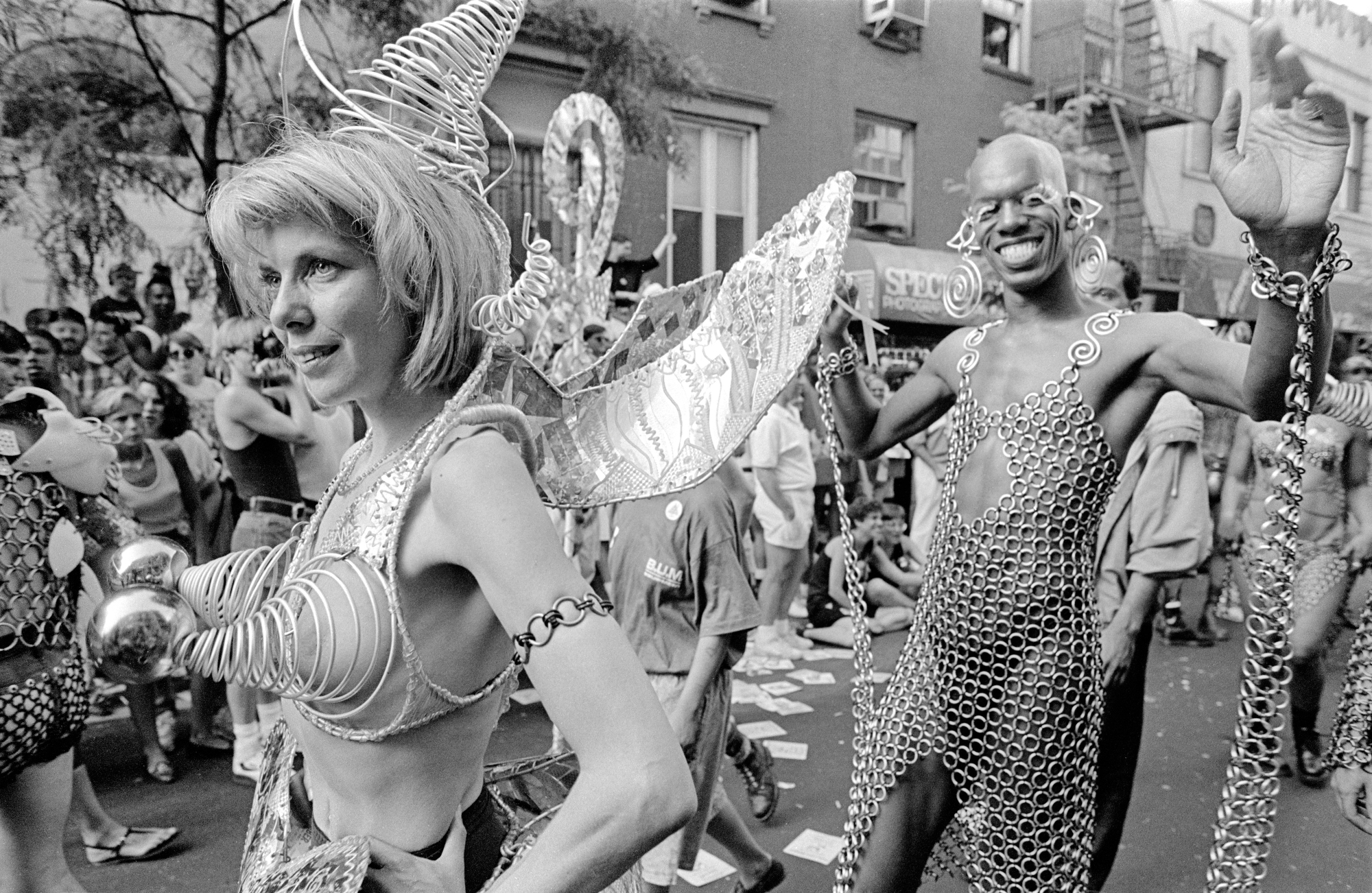 people dressed in metallic costumes take to the streets for a festival