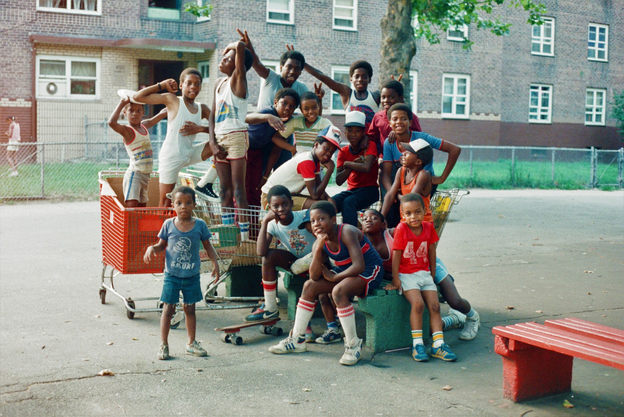 Young kids posing for a group photo in their New York CIty apartment complex during the 1980s