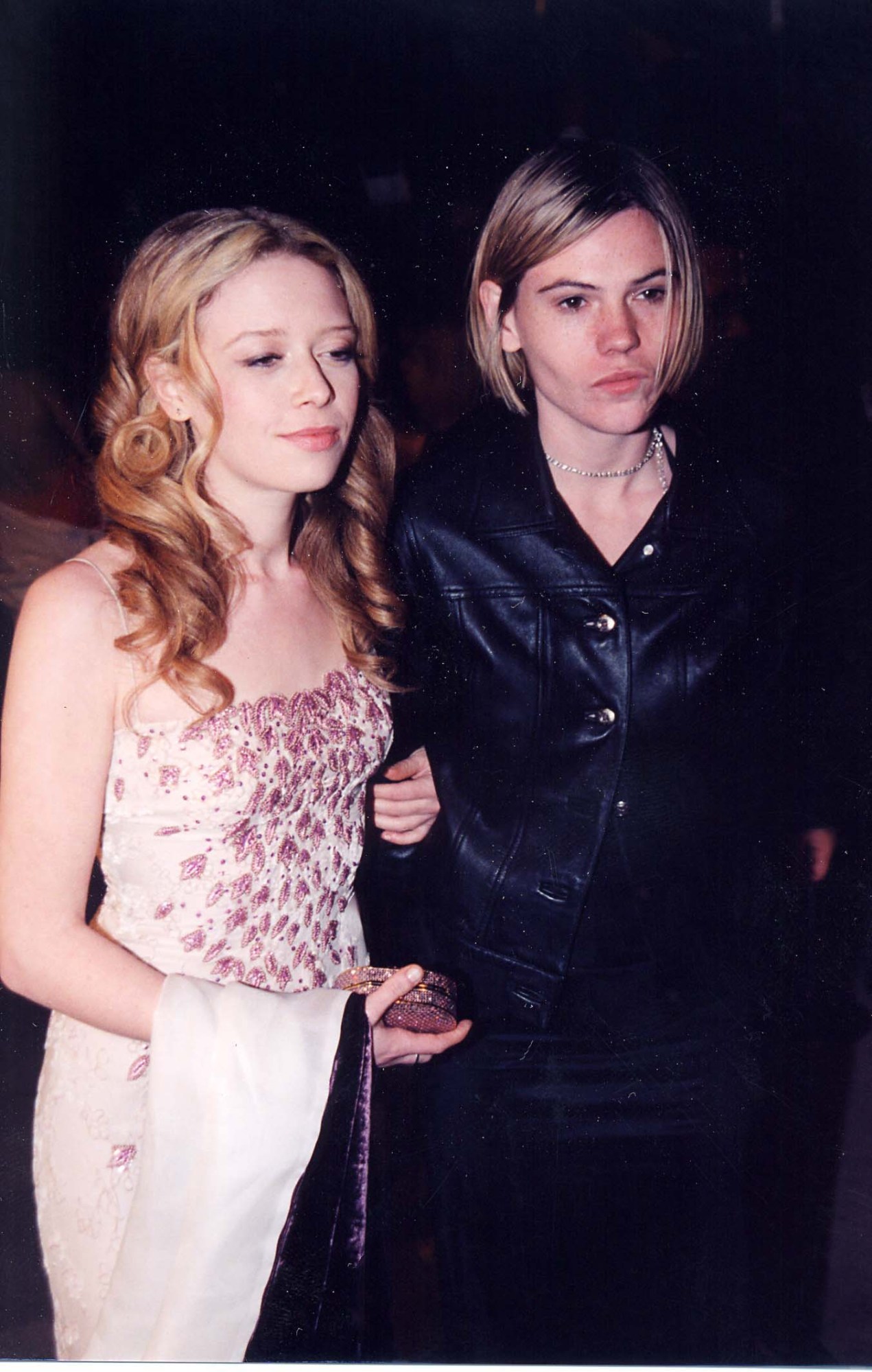 natasha lyonne on the arm of friend clea duvall wearing a pale pink prom dress