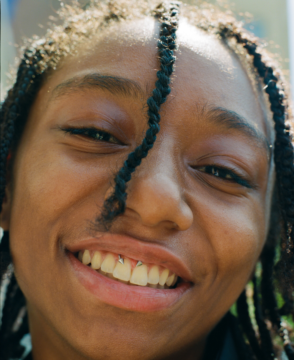 facial close up of a model with an inner lip piercing