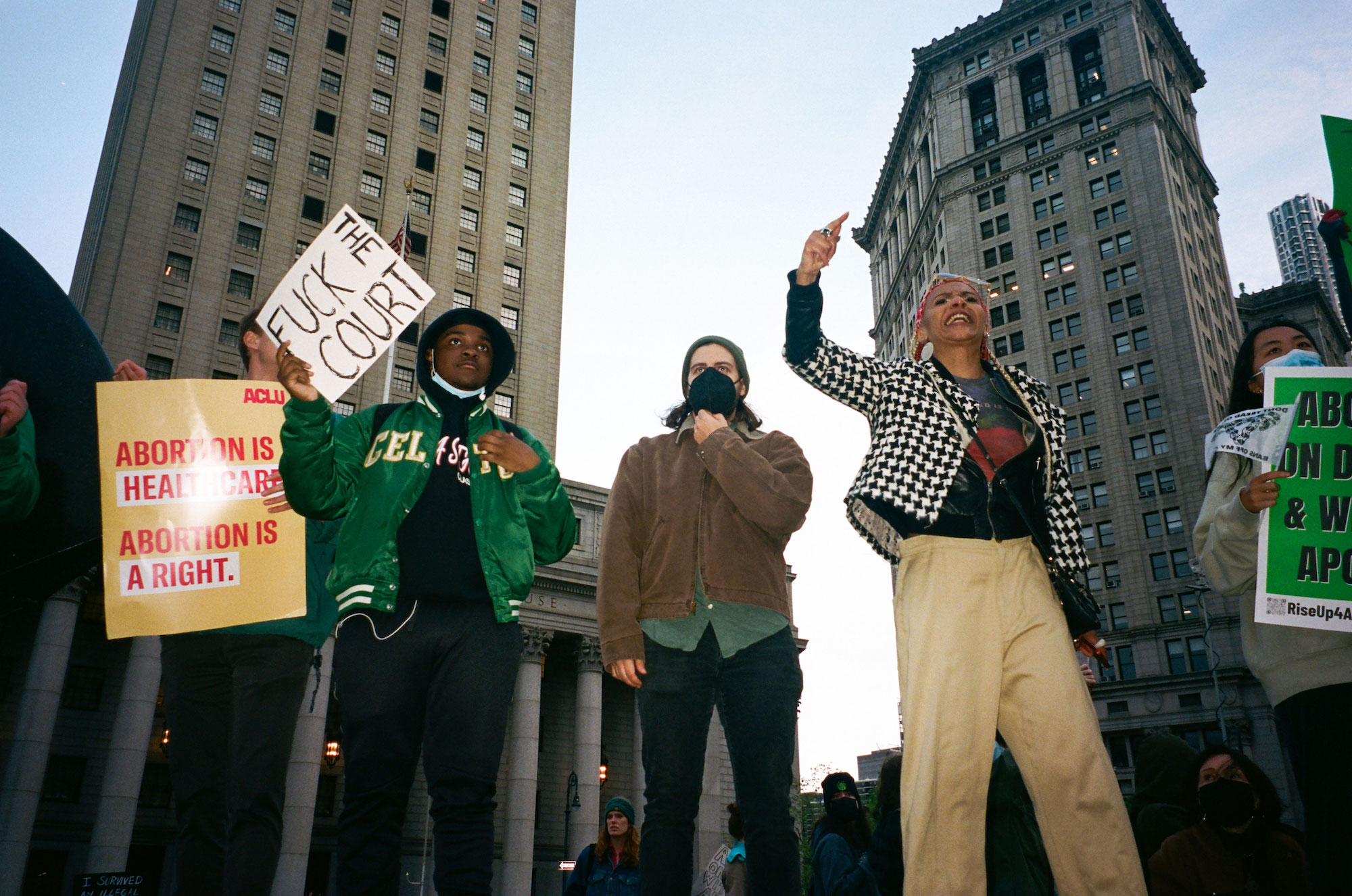 a group of abortion rights protestors standing in foley square