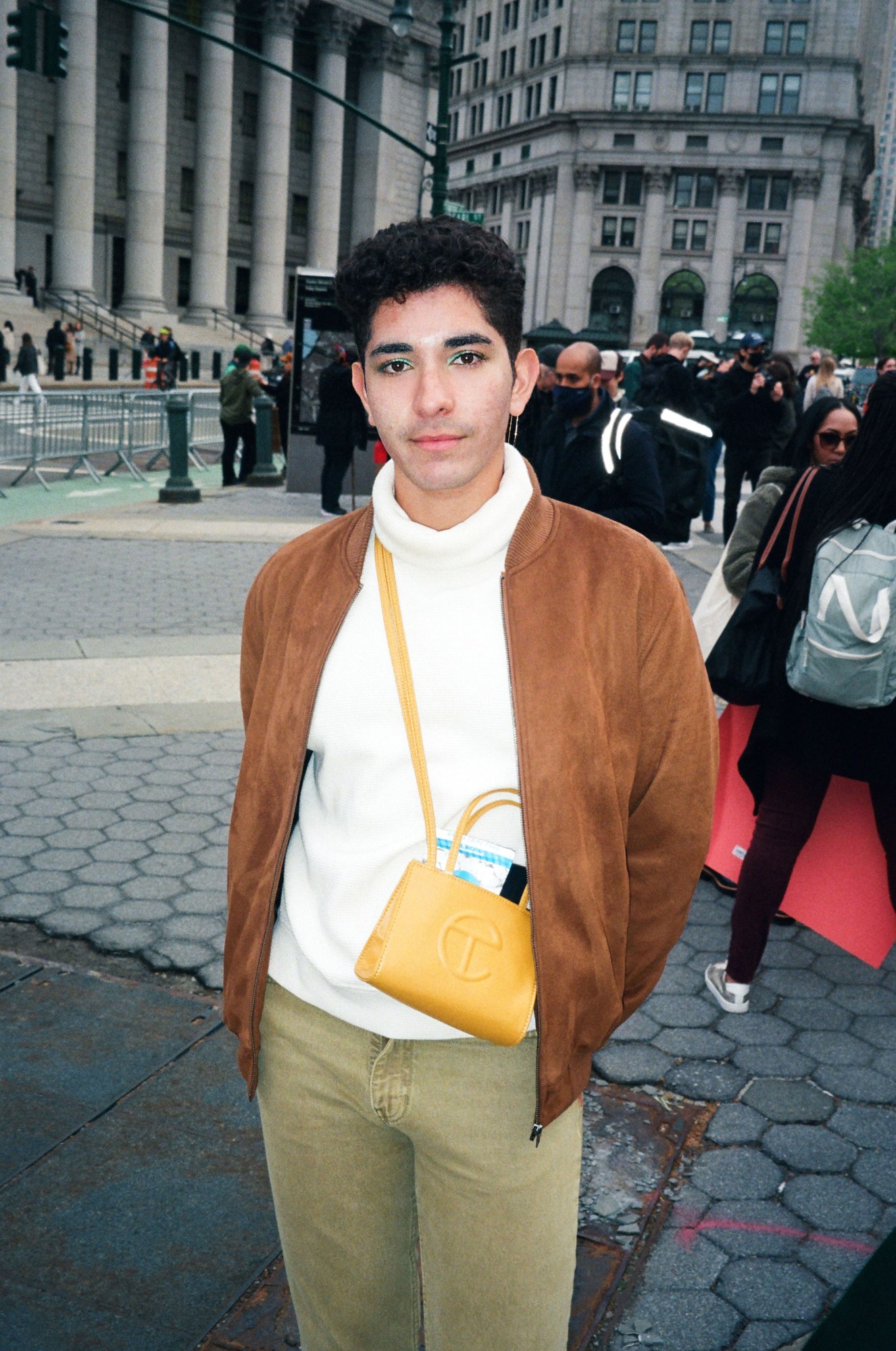 a boy standing in foley square at new york's abortion rights protests