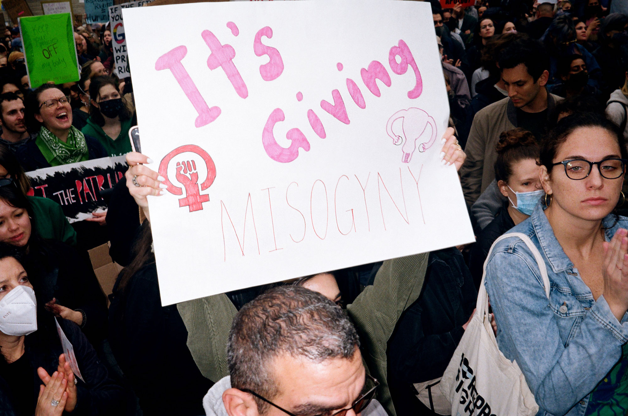 a sign that says it's giving misogyny