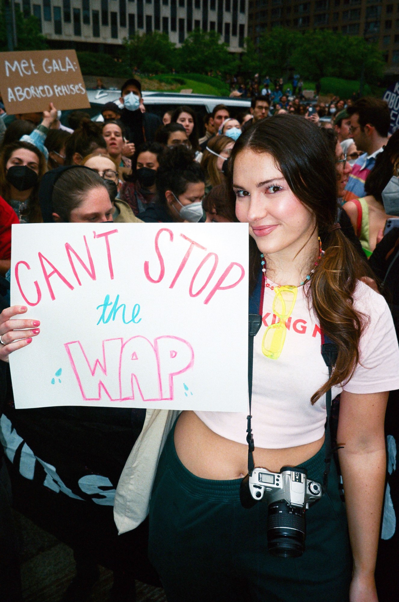 a protestor holding a sign that says can't stop the wap