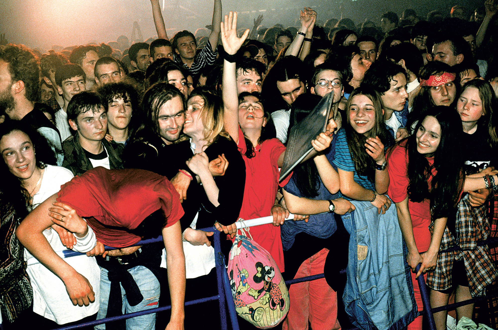 Young kids attending a concent in 90s Eastern Europe.