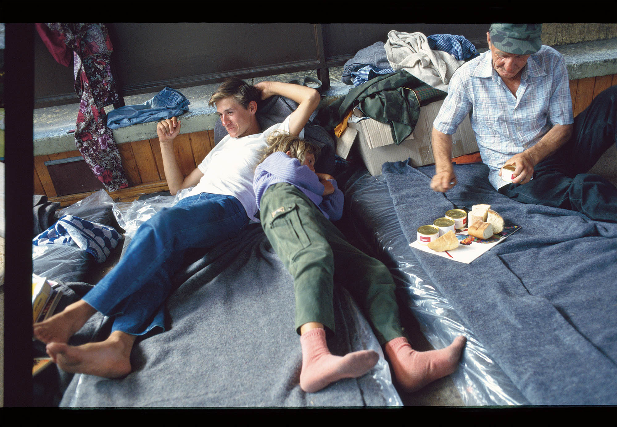 A family relaxing during lunch in 90s Eastern Europe.