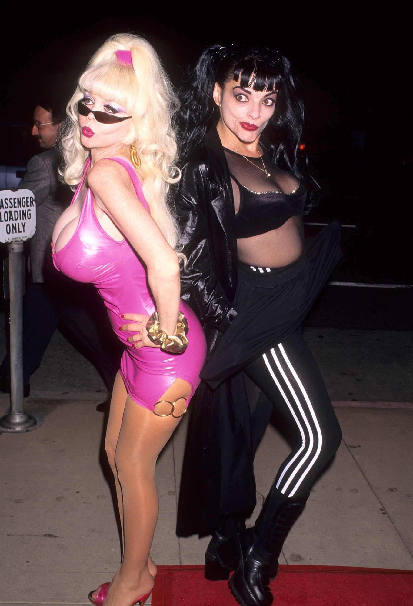 angelyne posing on the red carpet in a pink latex dress 1996