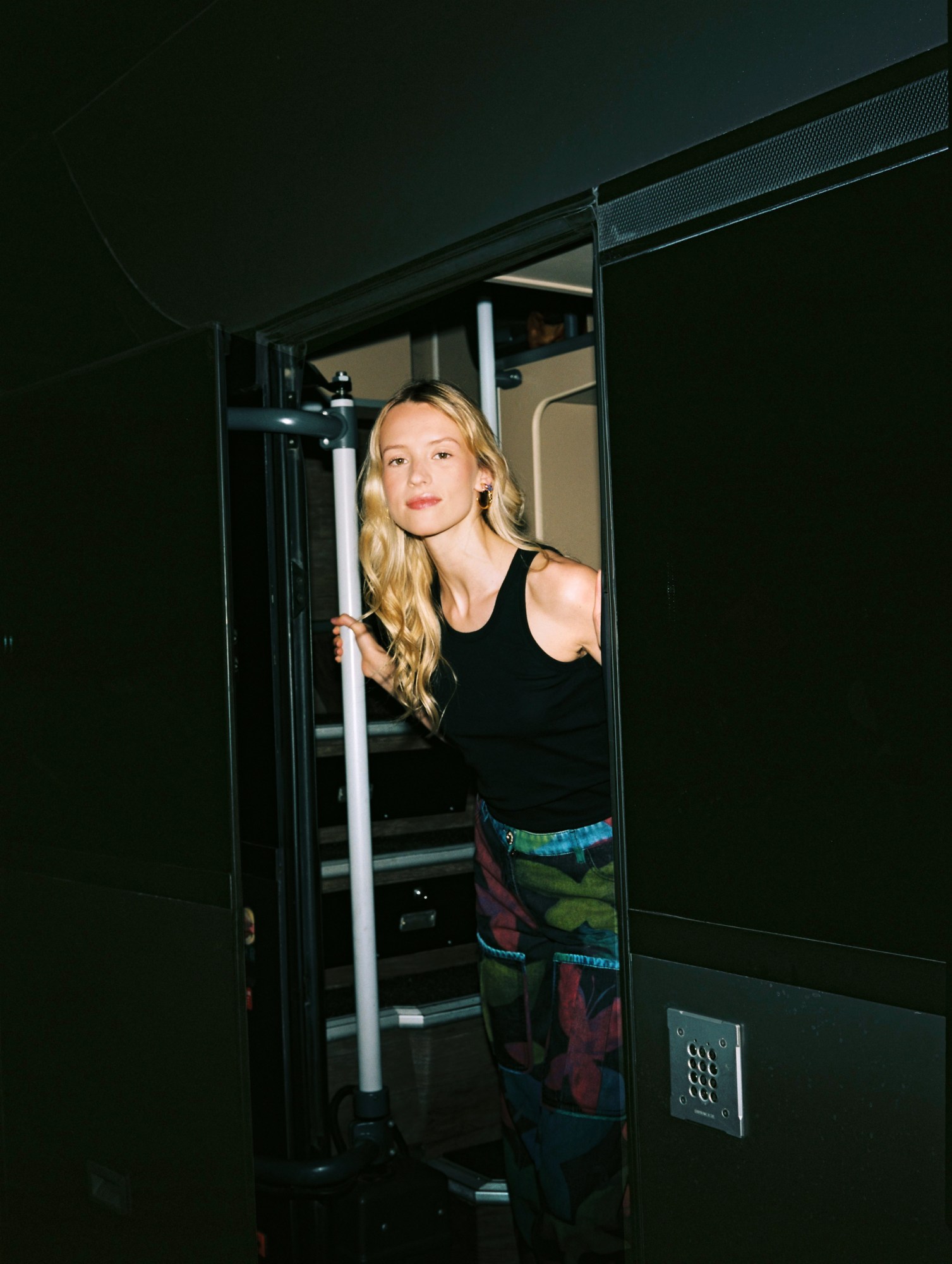 Angele looking out of her tour bus door