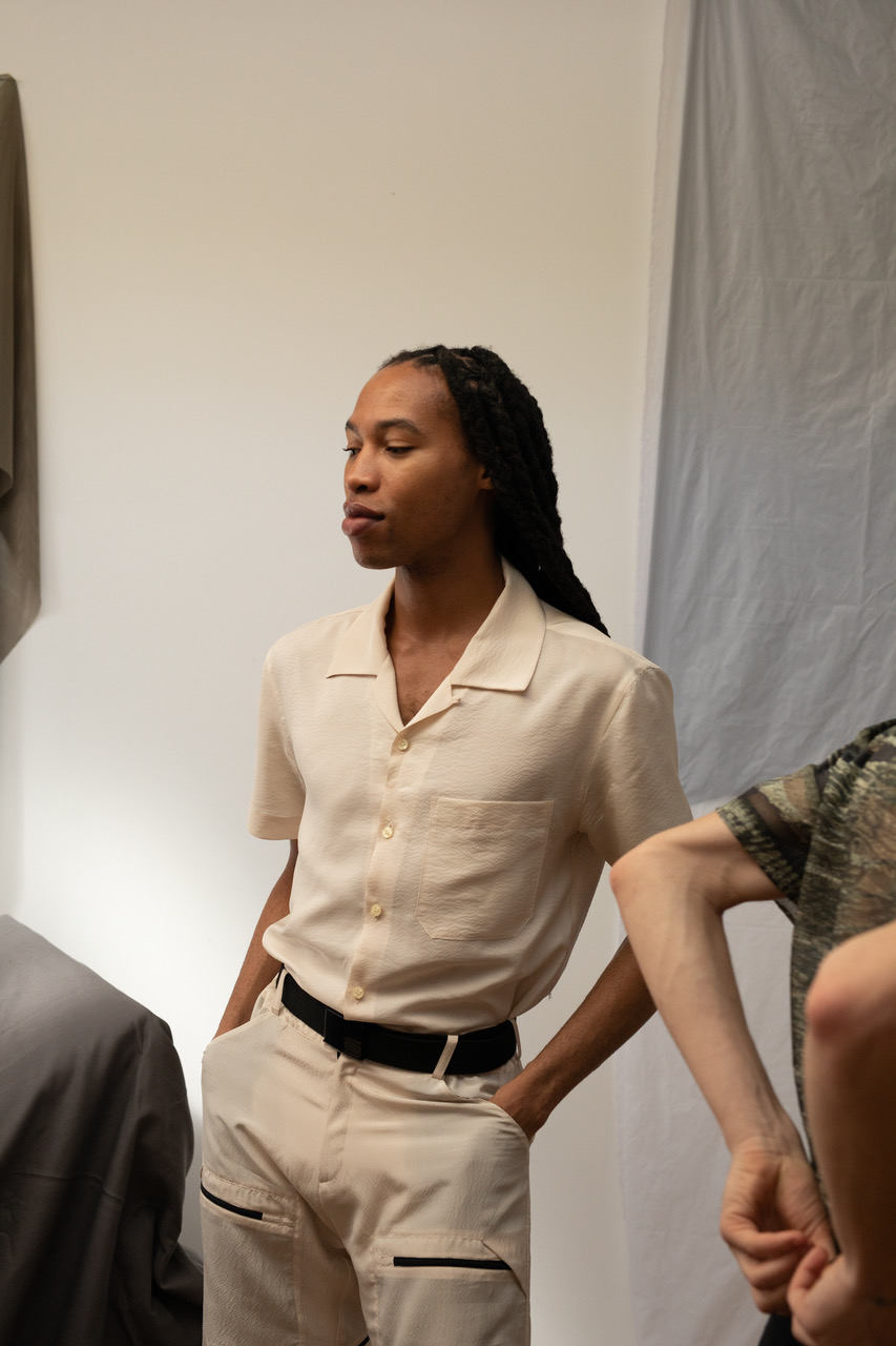 A model wearing a beige look from Olly Shinder's CSM graduate collection