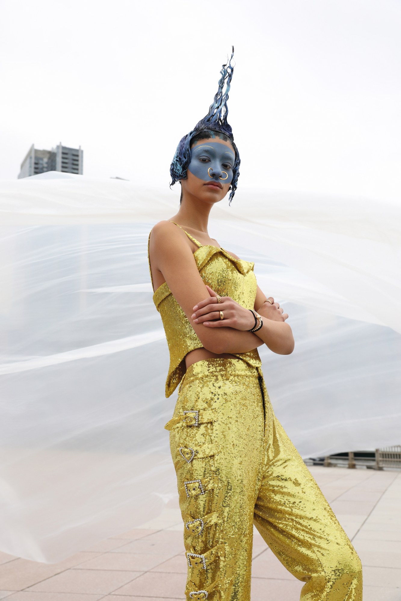 marsella rea wearing gold sequins and blue face paint in nyc by Dorian Ulises López Macías