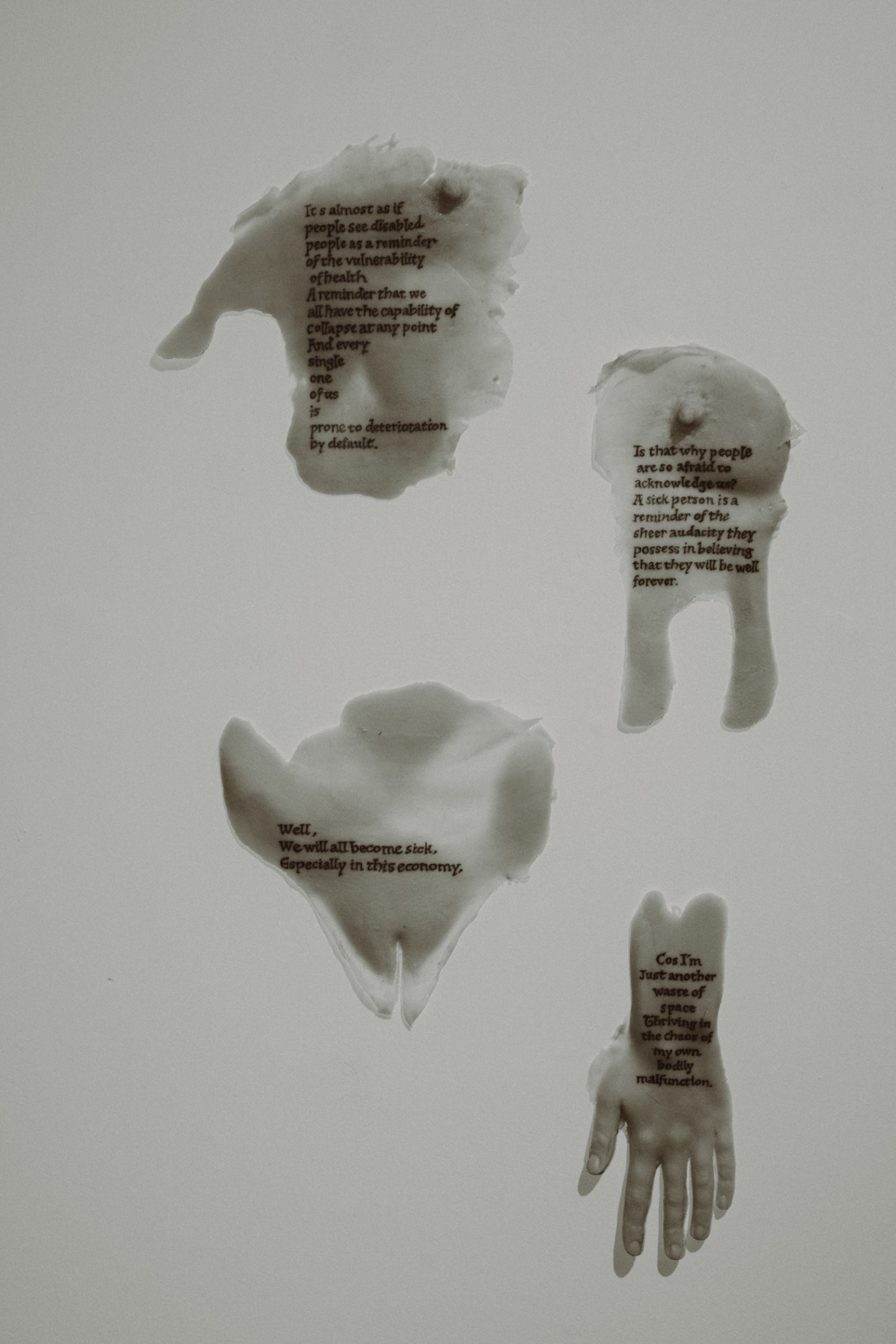 A collage of body parts with overlayed text by Yaz Metcalfe