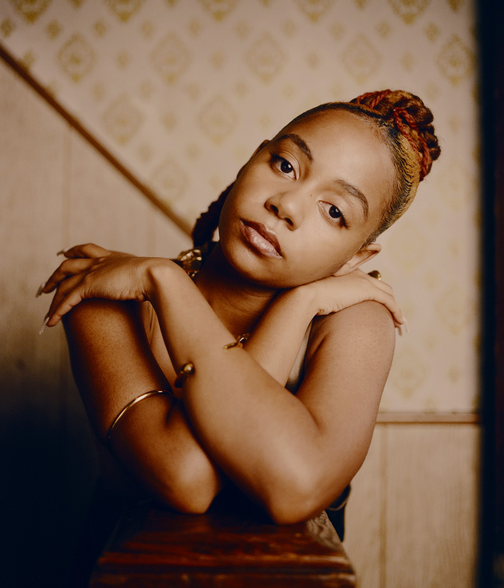 portrait of a girl with her arms crossed photographed by kendall bessent for chucha studios