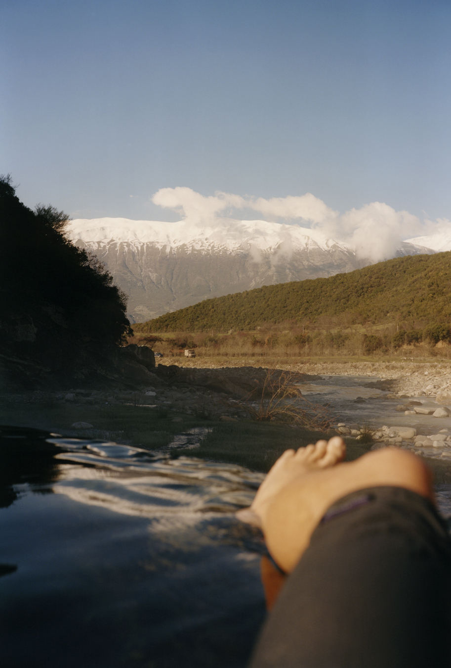 A person's leg and foot in the river Vjosa in Albania