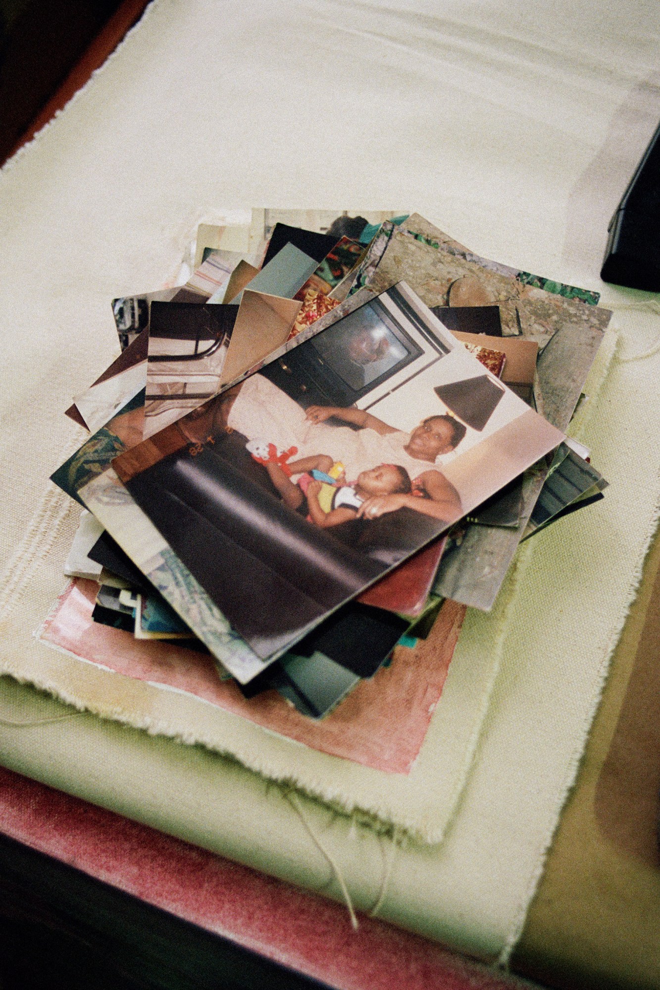 Family photographs at Madjeen Isaac's studio in Greenpoint, Brooklyn.