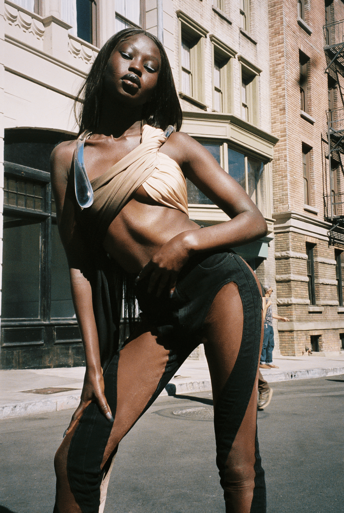 a model posing on a hollywood set wearing mugler ss22