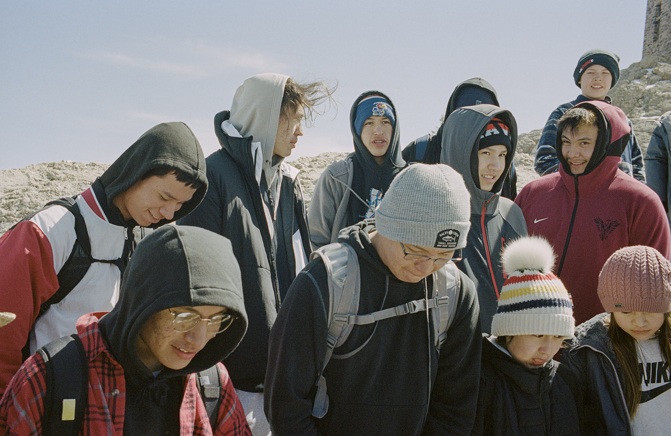 local indigenous people standing on the rocks for the Standing Rock star knowledge ceremony