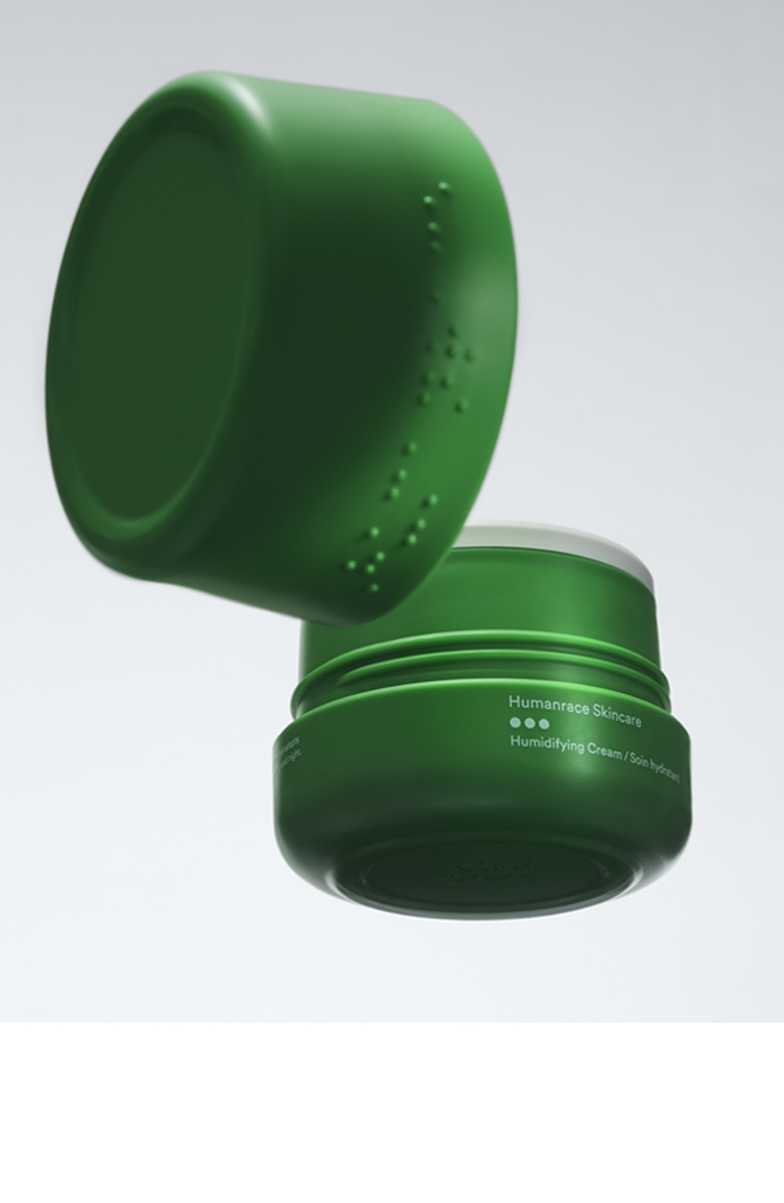 Humanrace body cream with a green plastic packaging