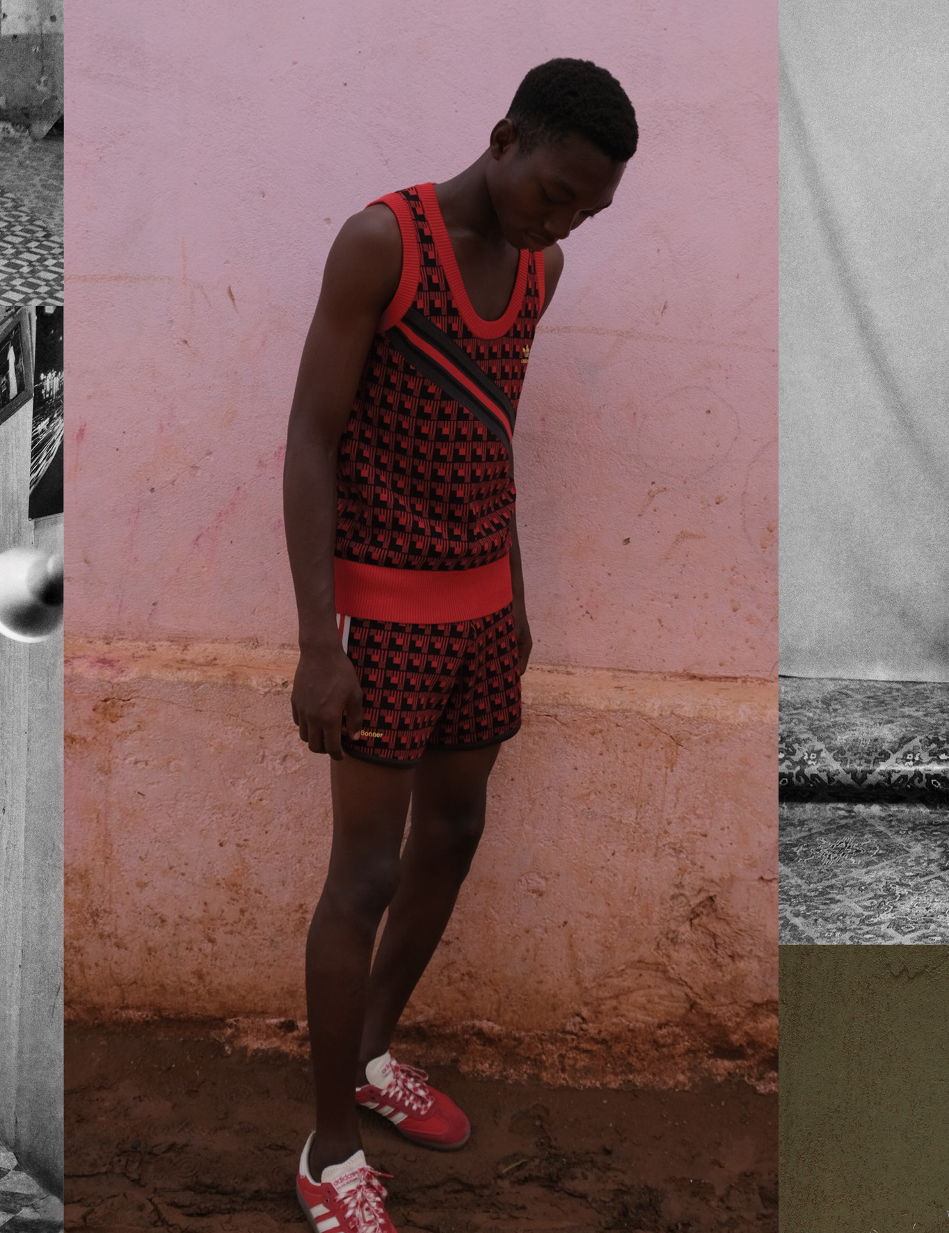 person in red shorts, vest and trainers in front of a clay wall.