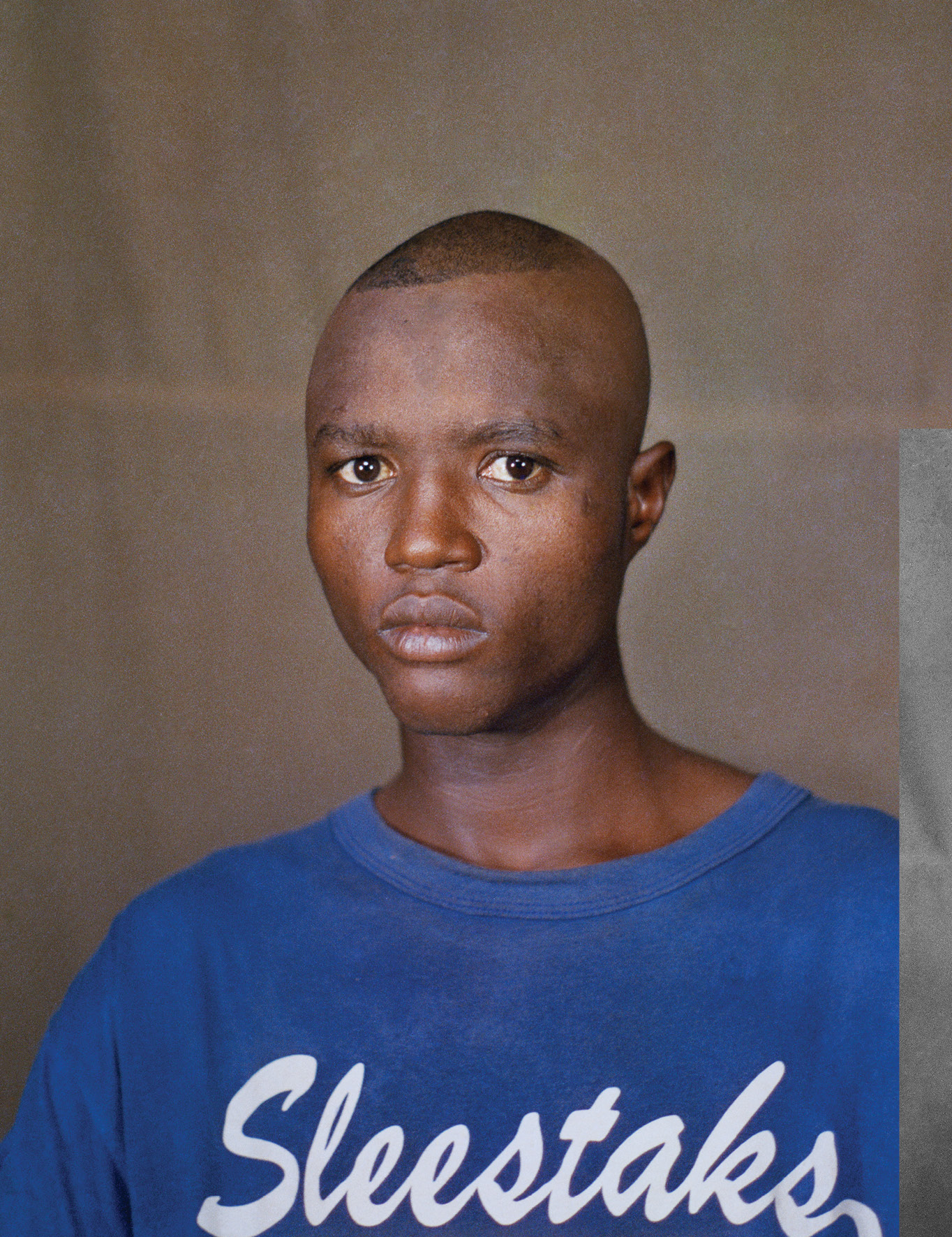 boy wearing a sleestaks t-shirt