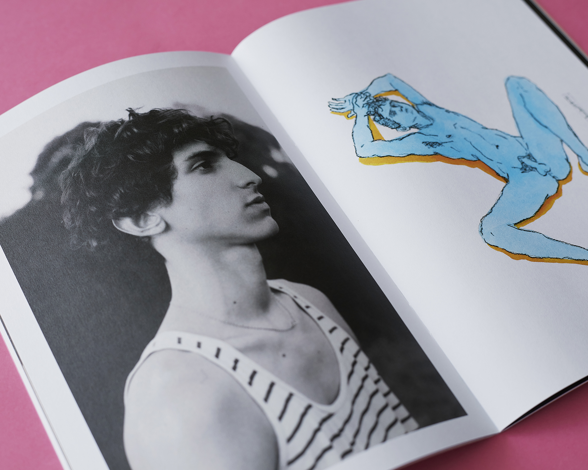 an open zine with a portrait of a man in a tank top on one page; a nude illustration on the other