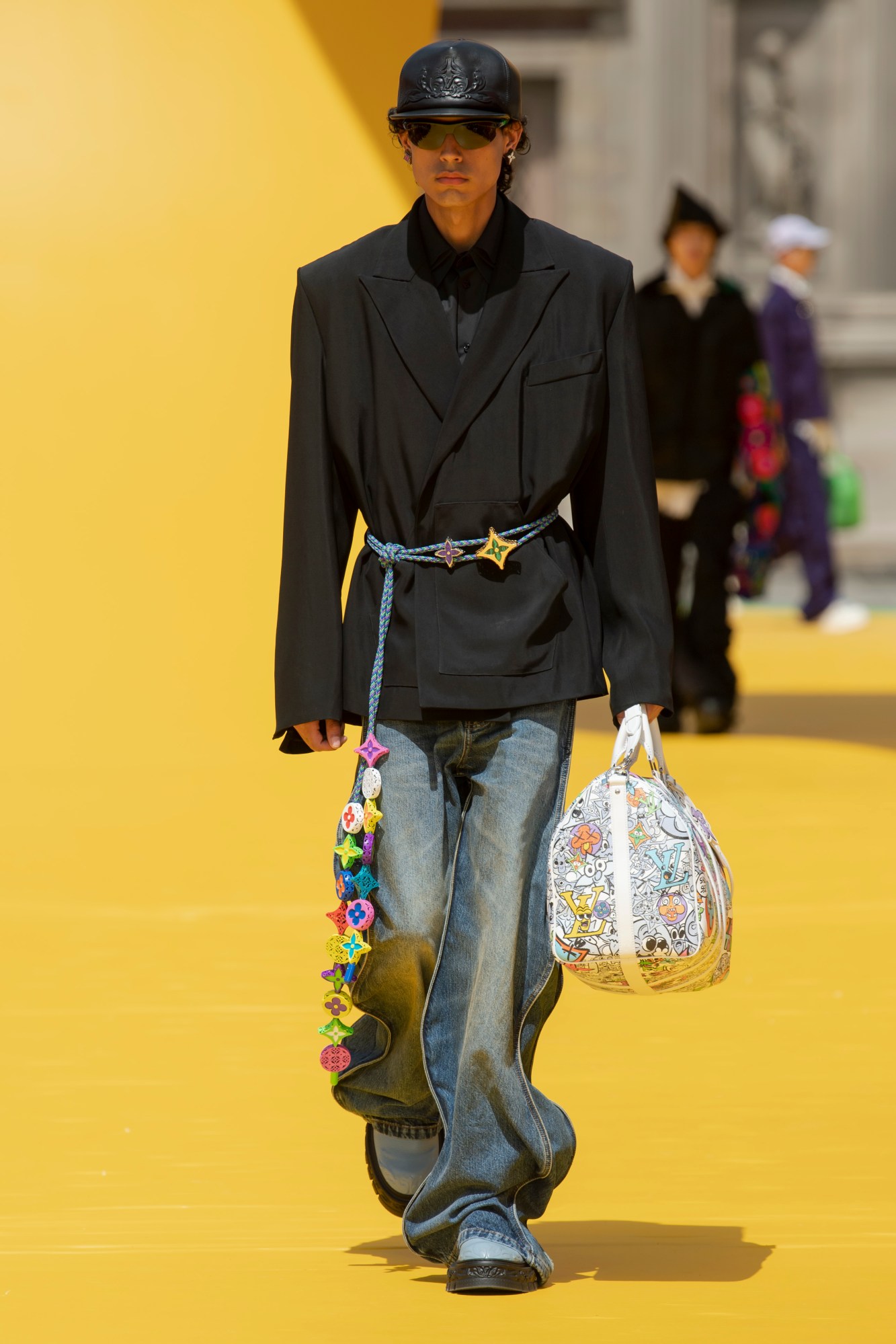 Model walking for Louis Vuitton SS23 menswear show