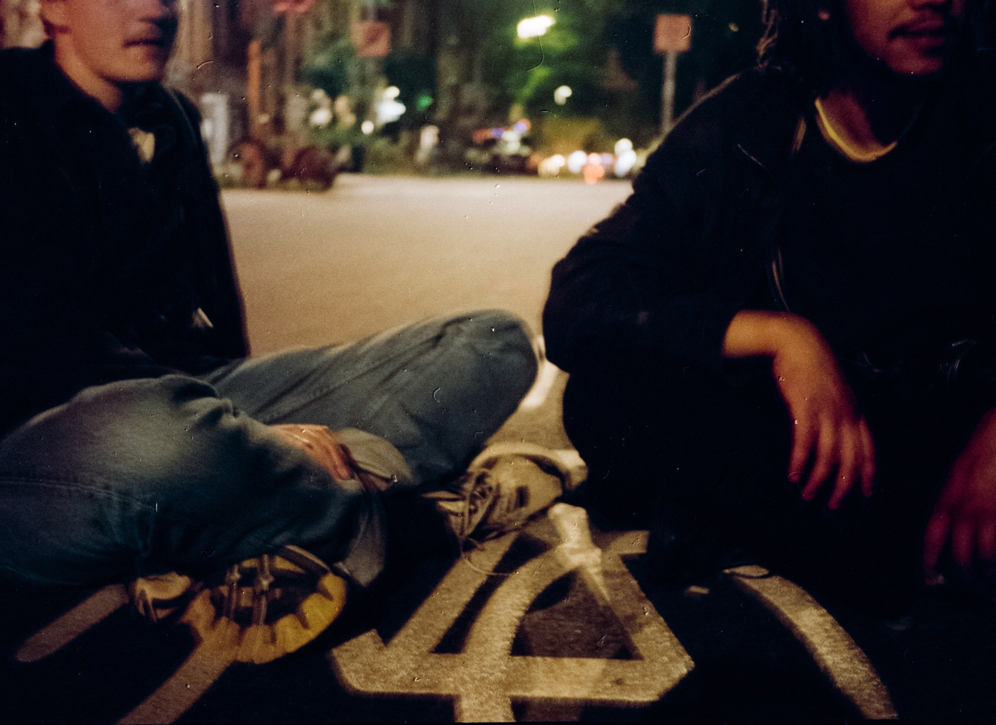 two men set on a road at night