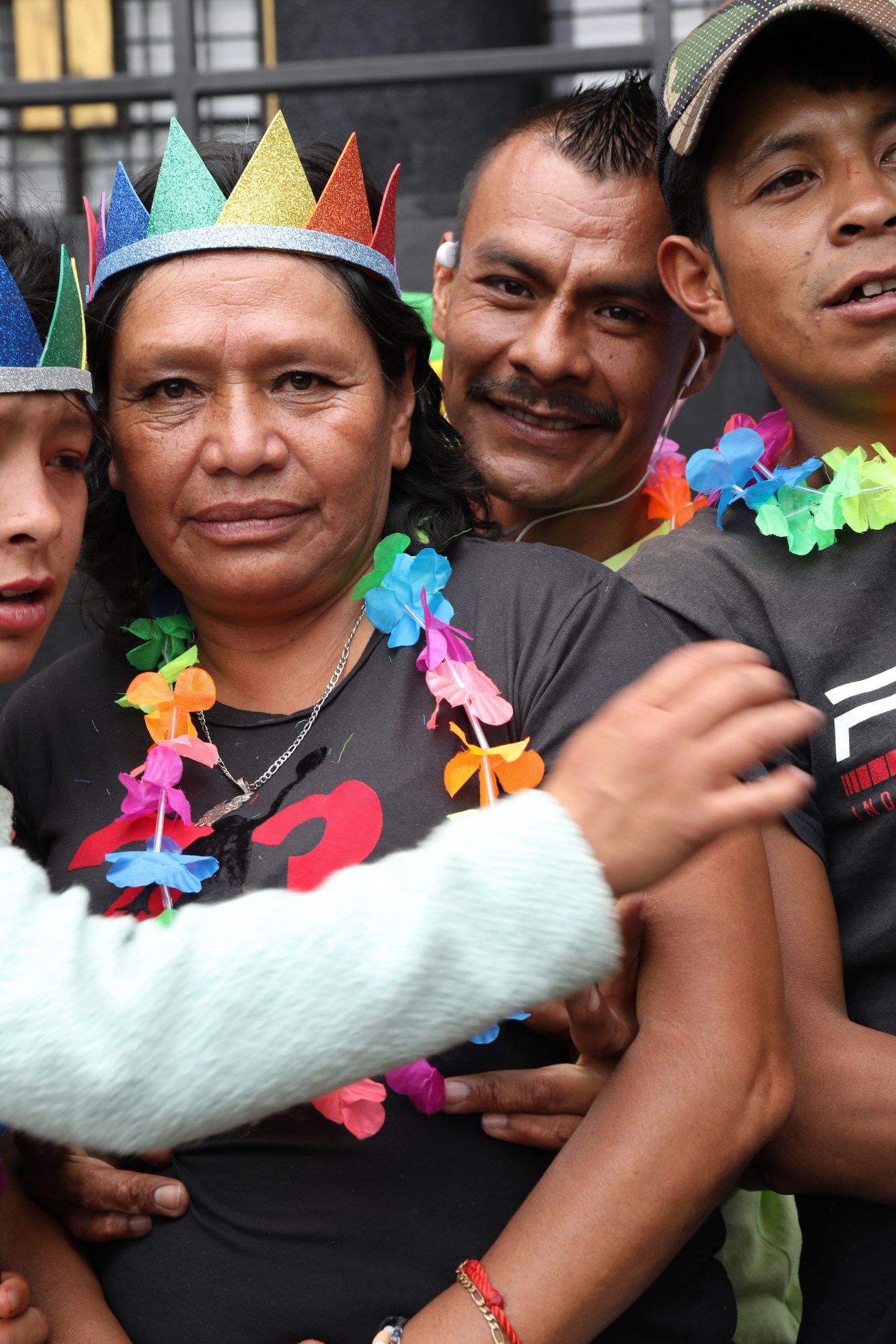 group hugging each other wearing rainbow garlands at Mexico Pride 2022