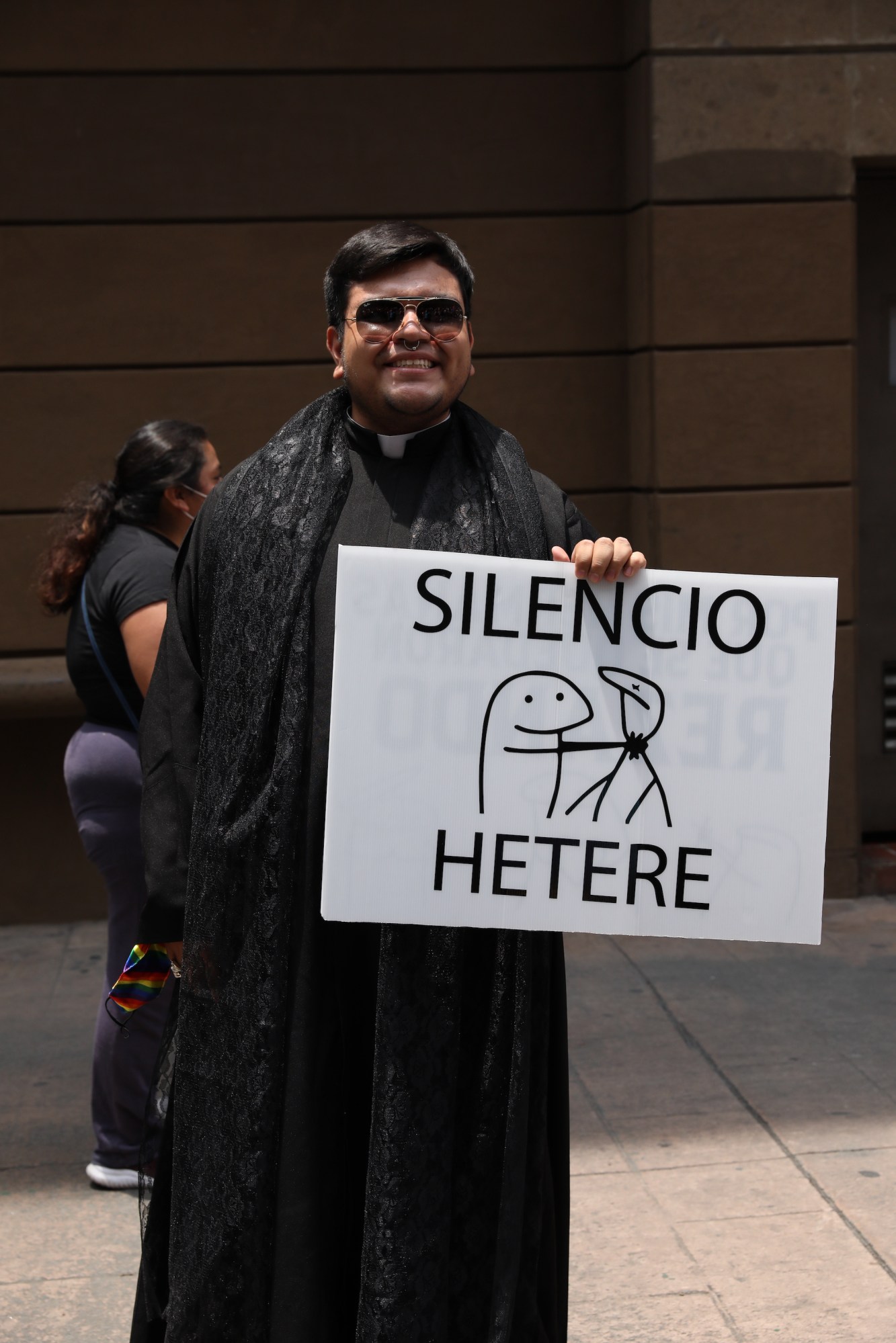 person with a sign that says silencio hetere at Mexico Pride 2022