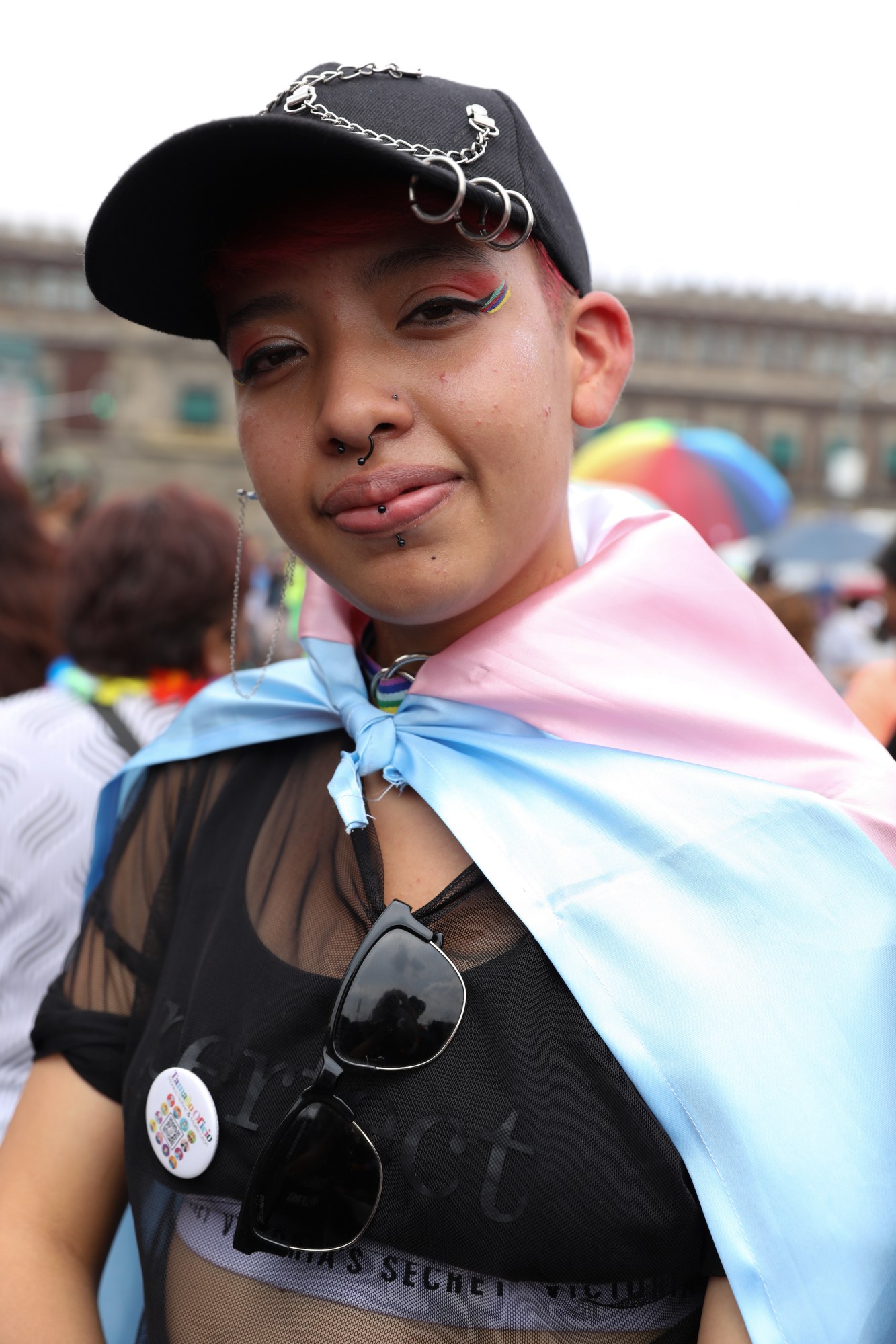 person with a trans pride flag tied around them at Mexico Pride 2022