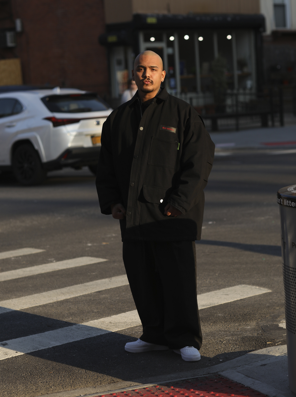 man standing outside on a road crossing in I-D 369 The Earthrise Issue