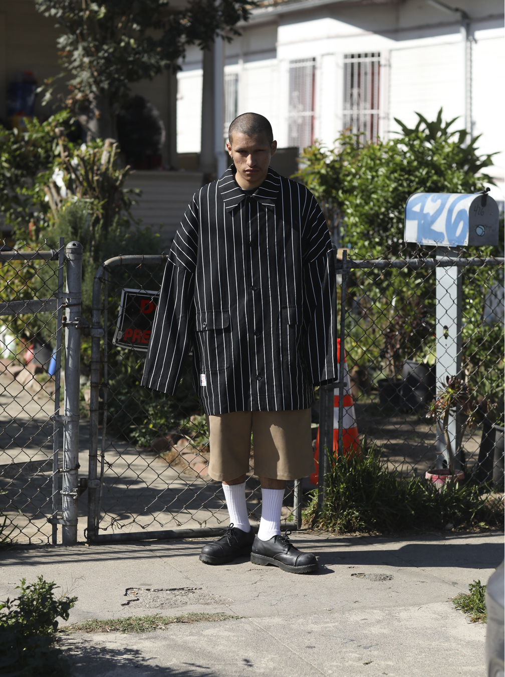 man standing by a gate in I-D 369 The Earthrise Issue