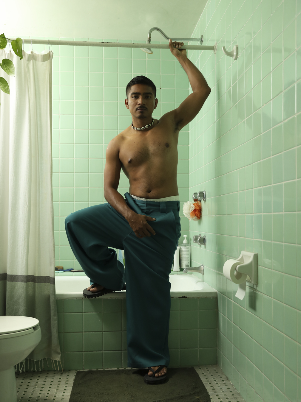 man standing in a bathroom in I-D 369 The Earthrise Issue