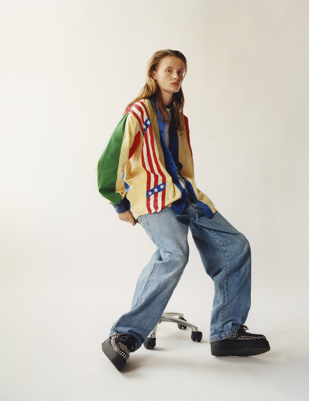 model sitting wearing a shirt and jeans in i-D 369 the Earthrise issue