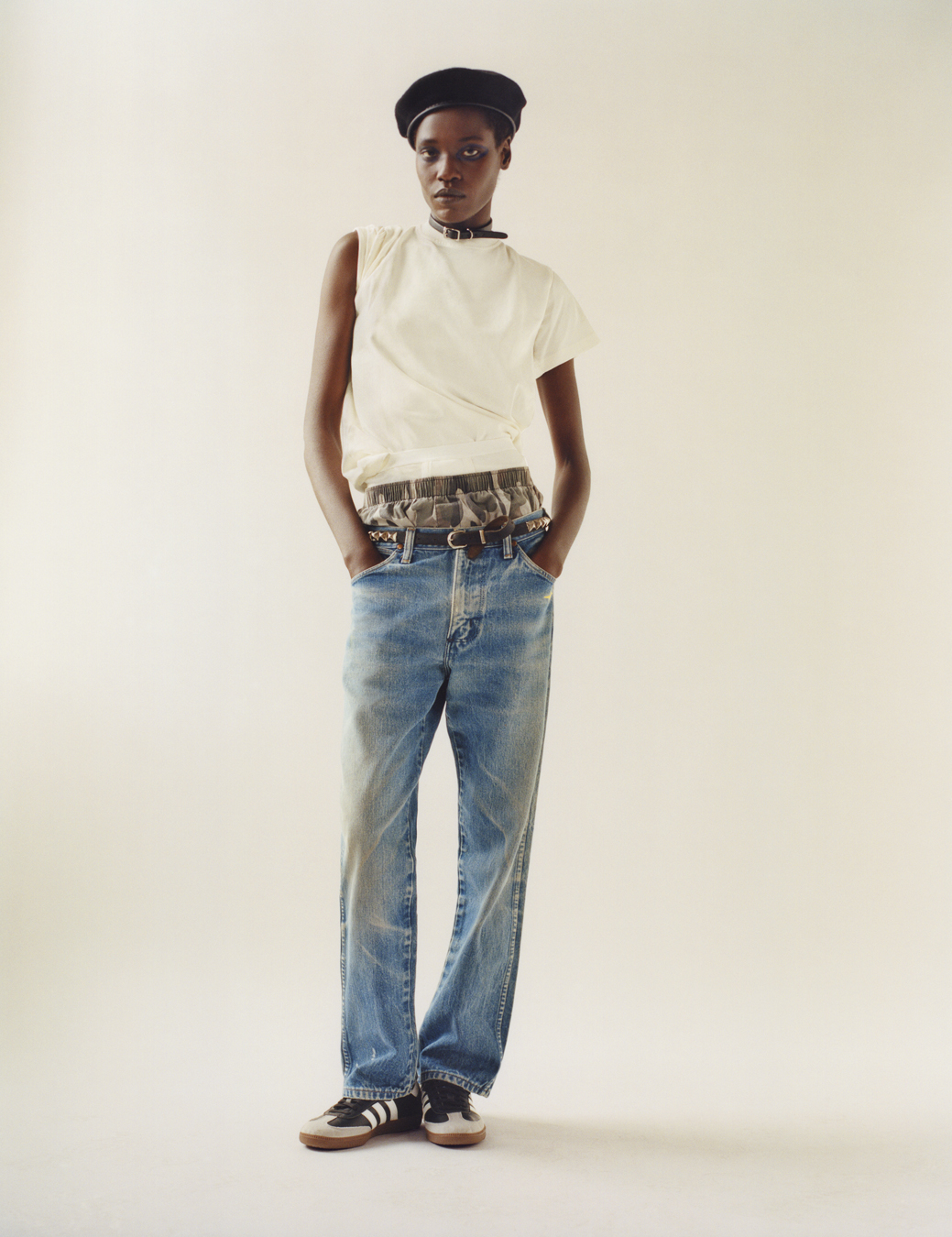 model wearing a white top, boxers, blue jeans and trainers in i-D 369 the Earthrise issue