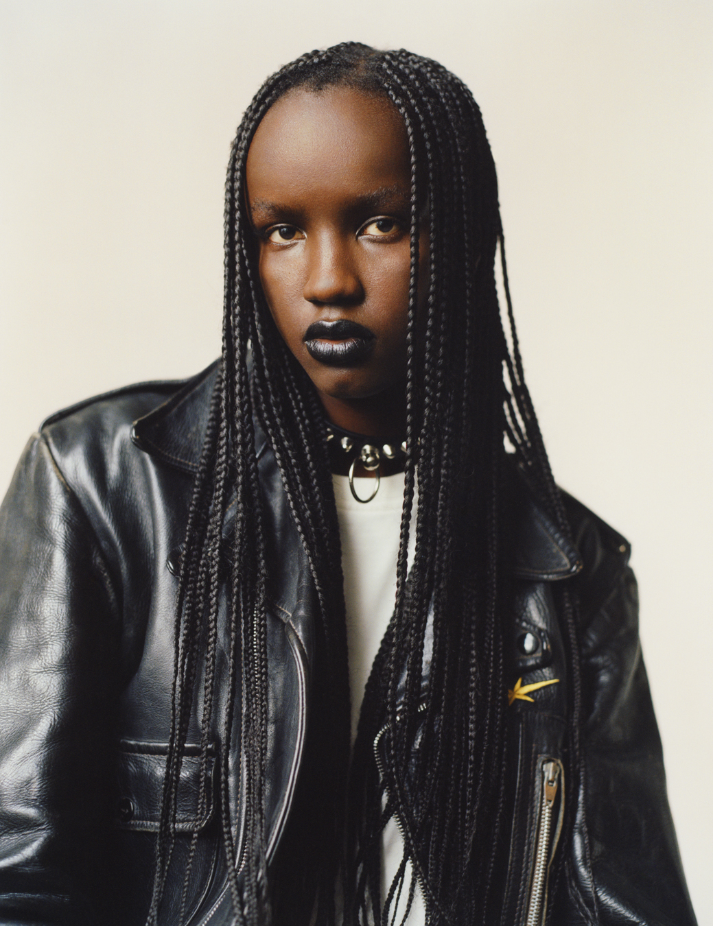 model wearing a white top, leather jacket and choker in i-D 369 the Earthrise issue