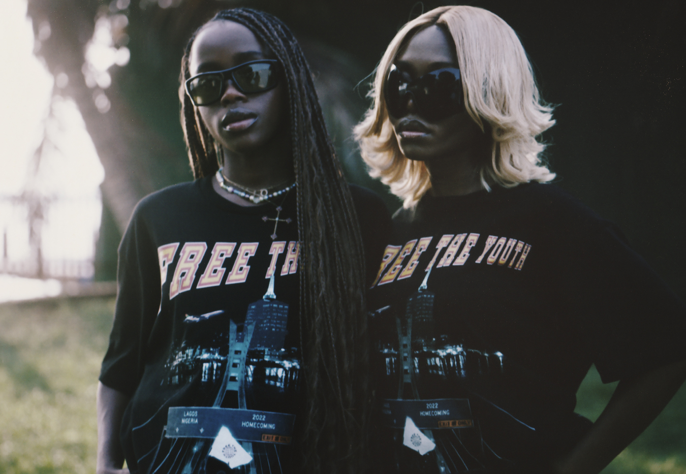 two people wearing black printed tees and bug sunglasses standing outside in I-D 369 The Earthrise Issue