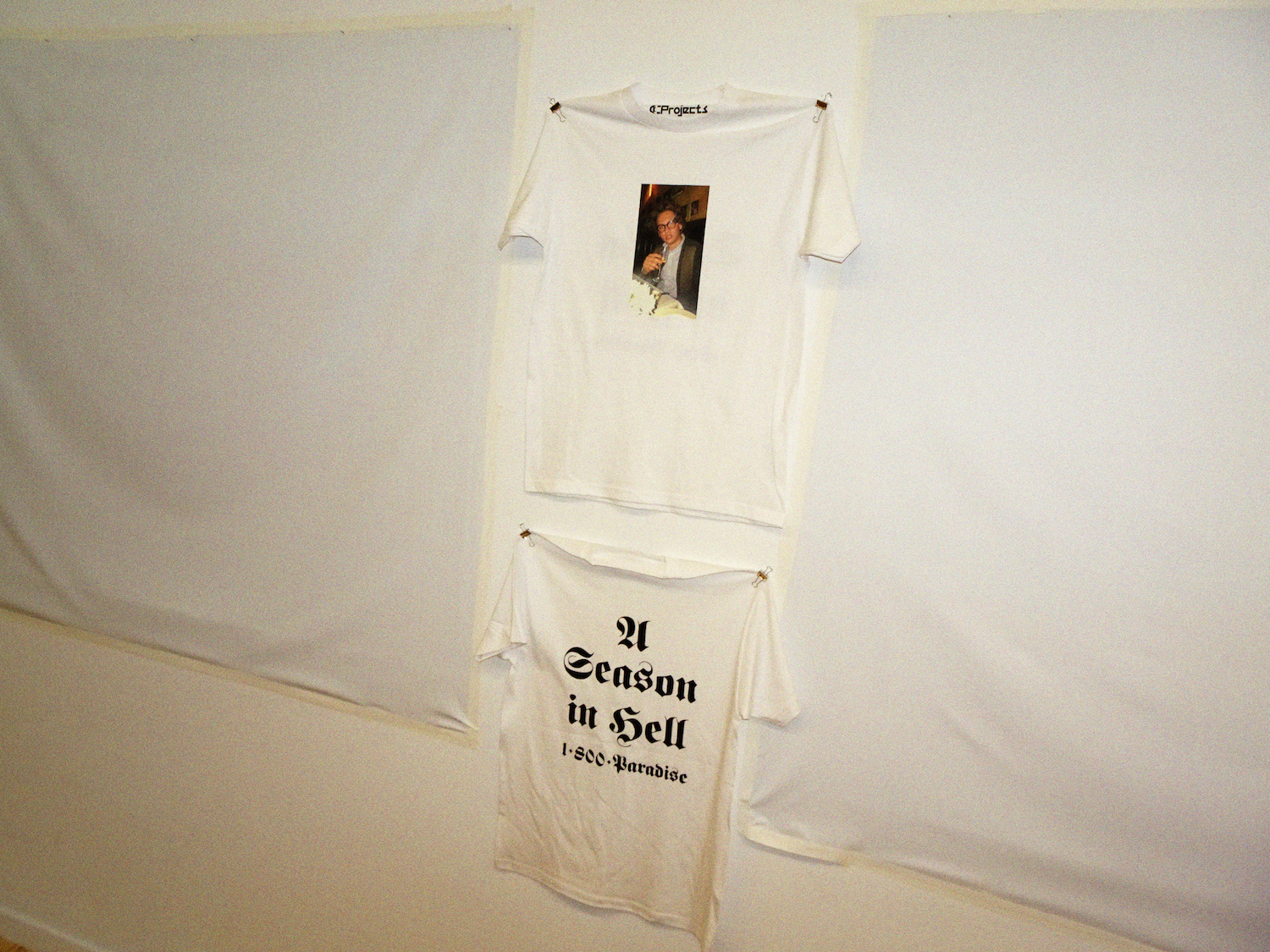 a tshirt with a photo that says a season in hell pinned up on the wall