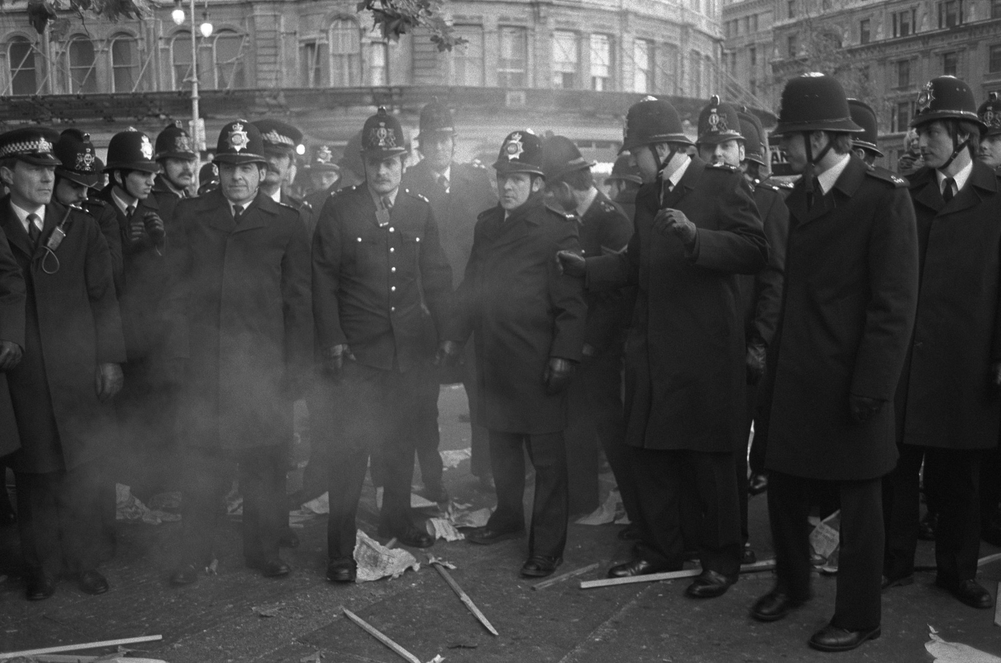 Black-and-white photo of Policemen gathered outside in London