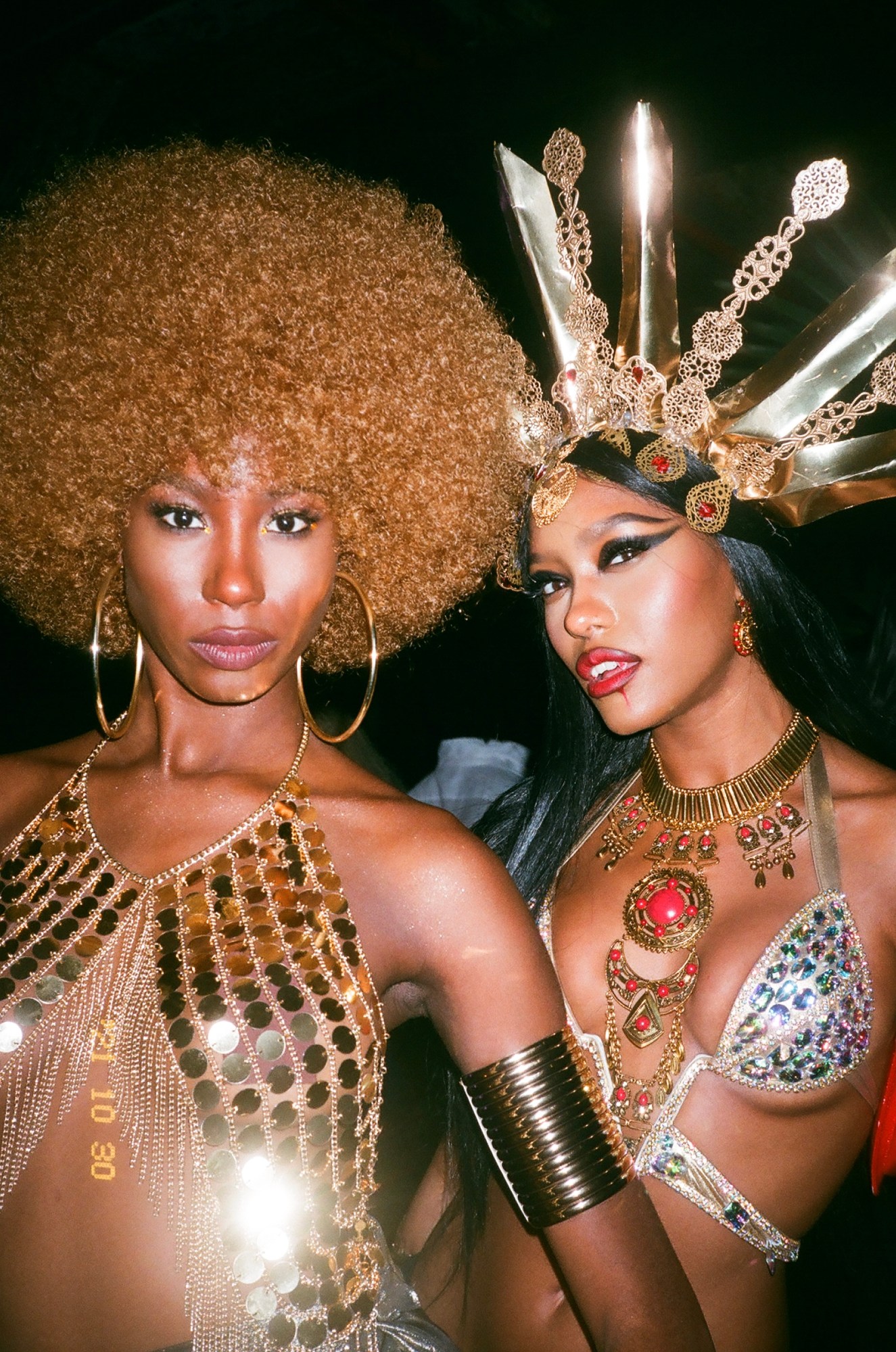 Women in metal and sequin tops at a party in Brooklyn