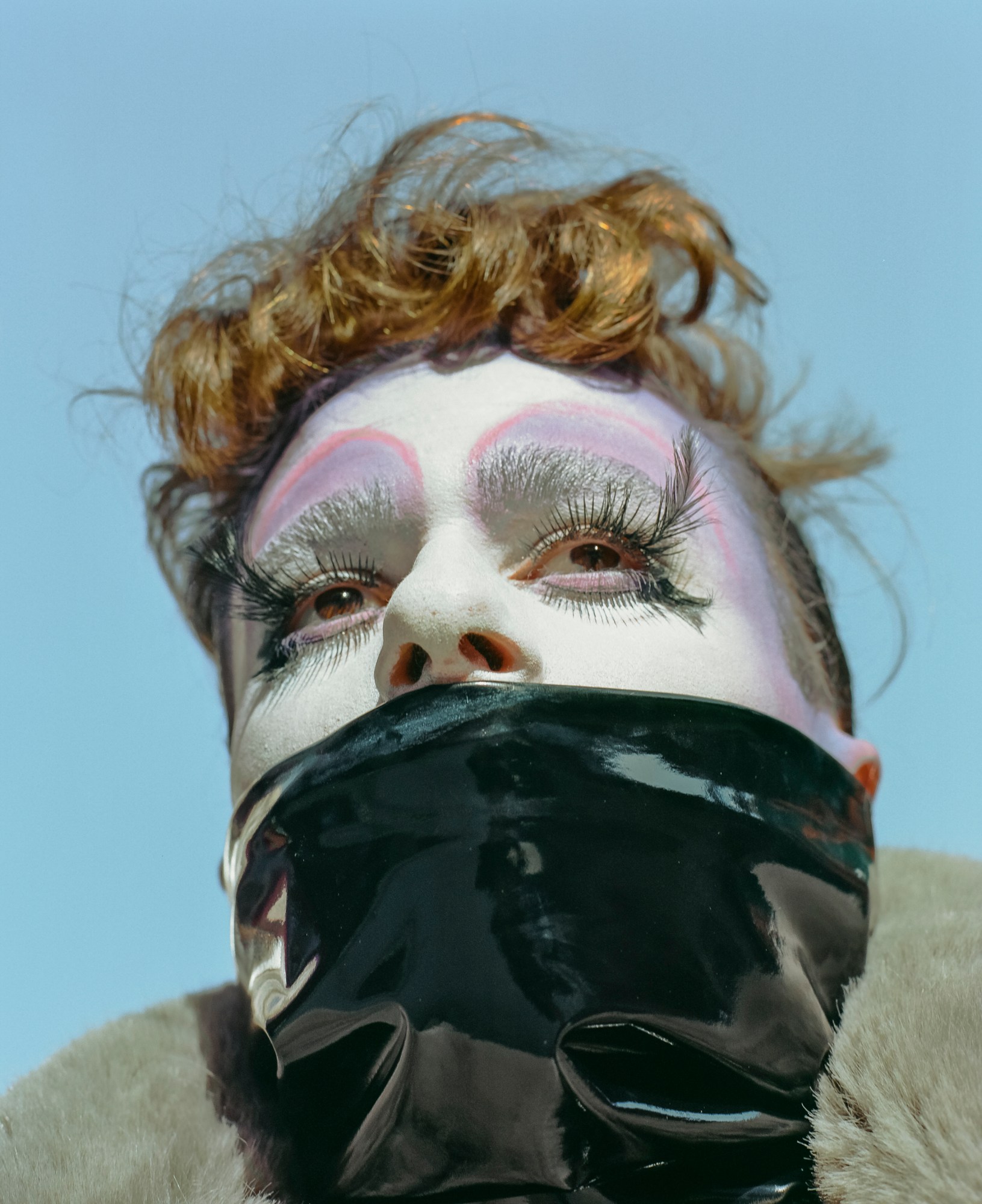 A young Orthodox Jewish man wearing drag makeup.