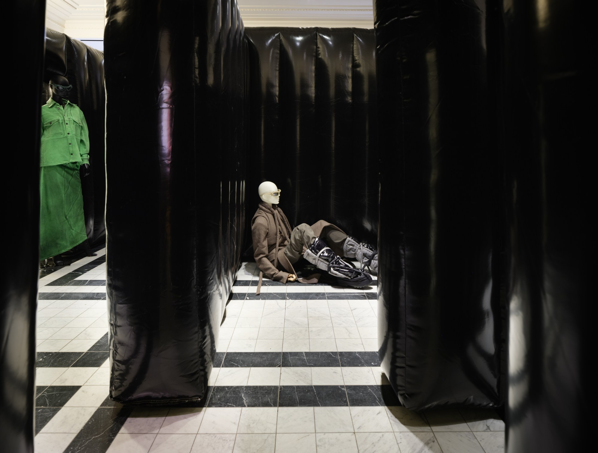 Art installation at Selfridges by Ottolinger and Jan Vorisek of mannequins in clothes hiding in a maze of black pvc walls