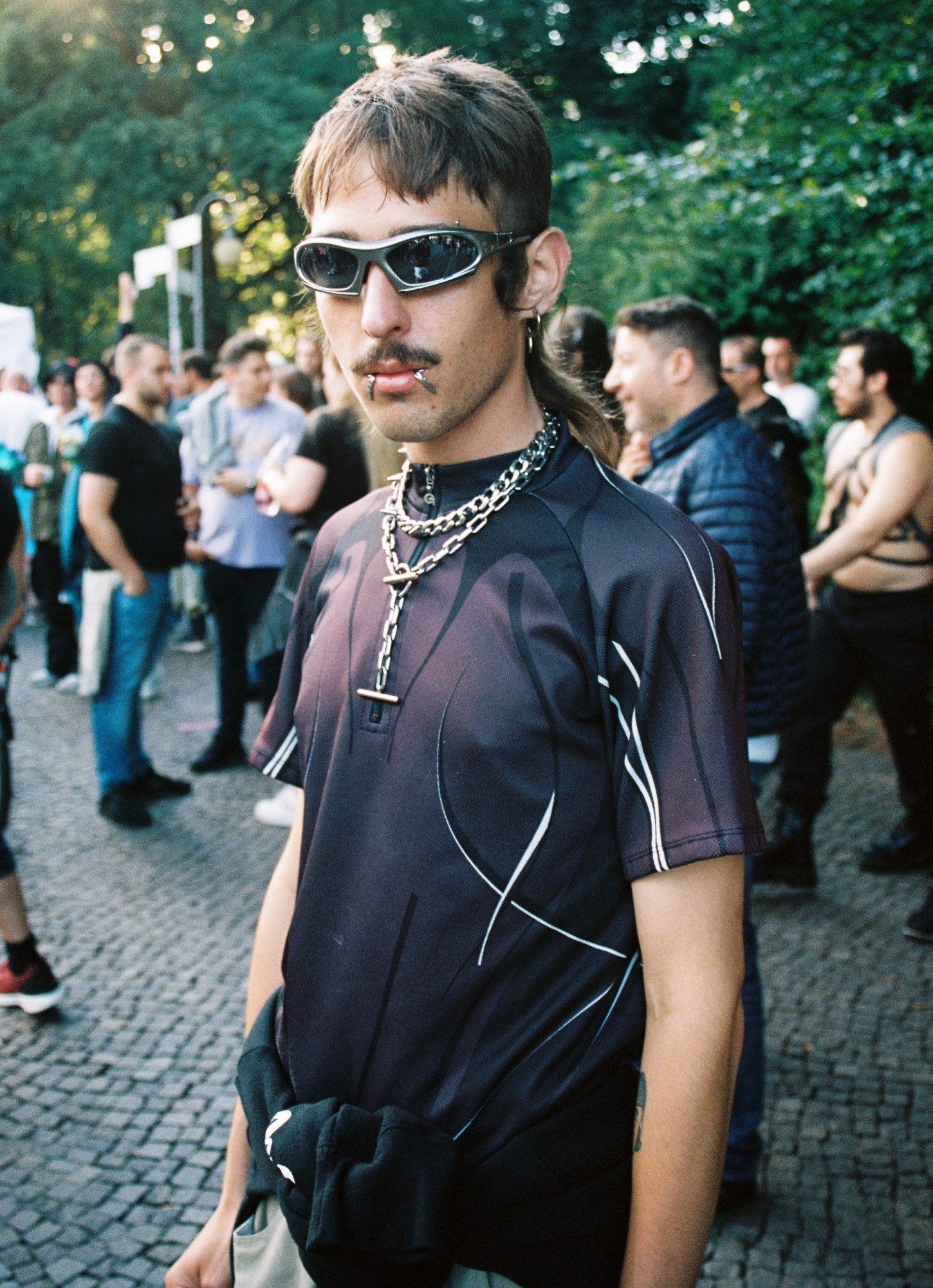 a techno goth with a mullet looks to camera