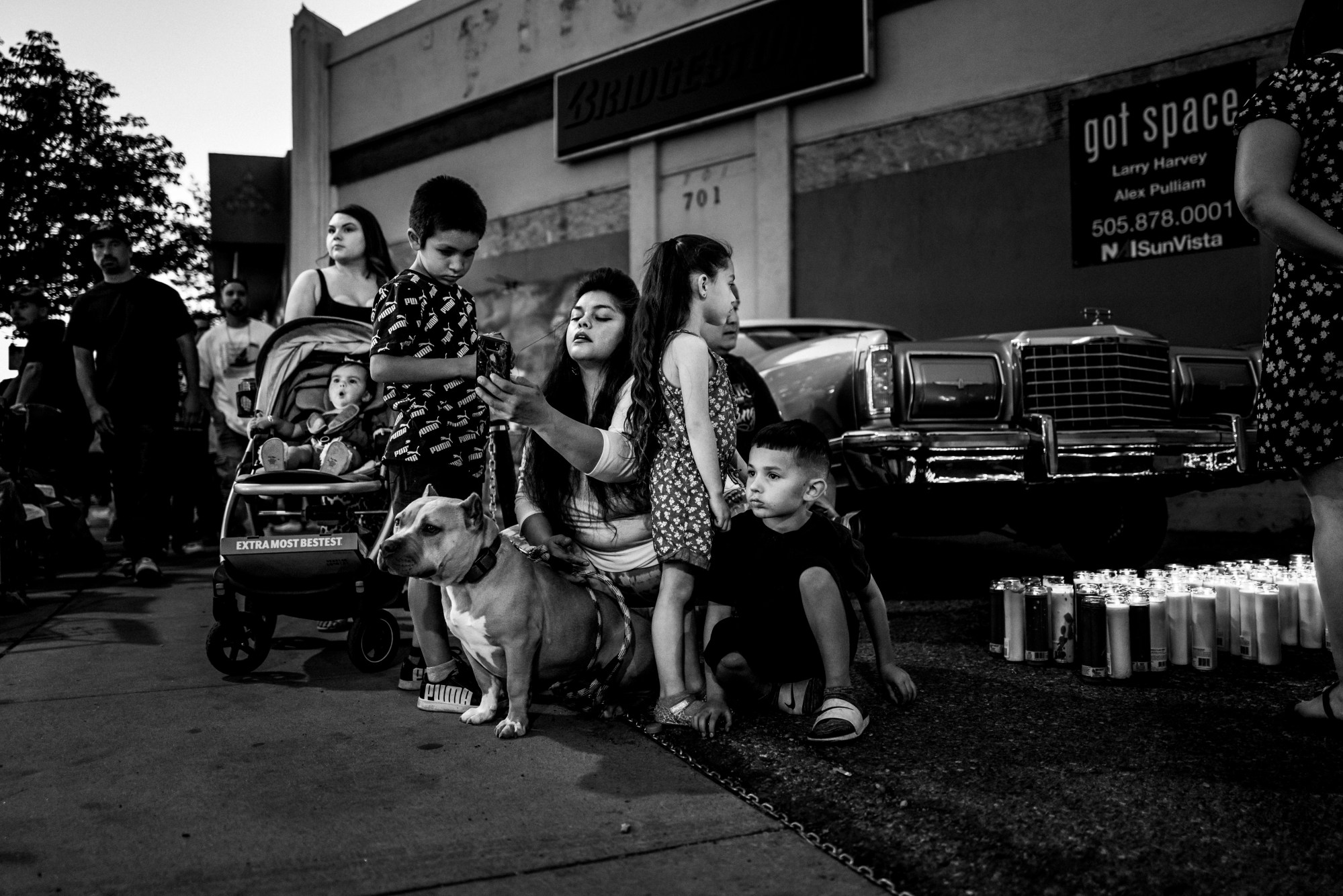 a mother surrounded by her dog and children