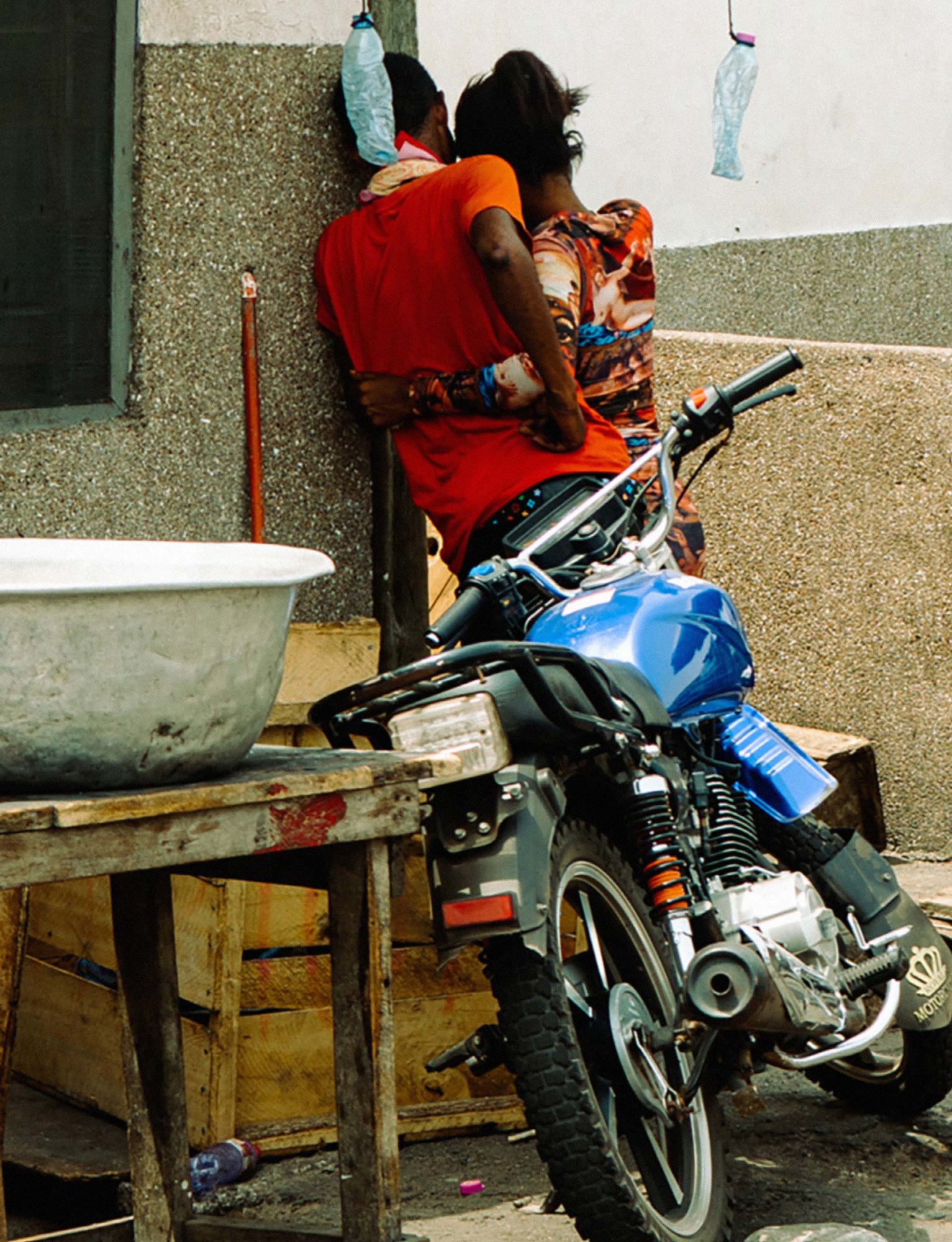 A couple holding cuddling, Jamestown, Accra