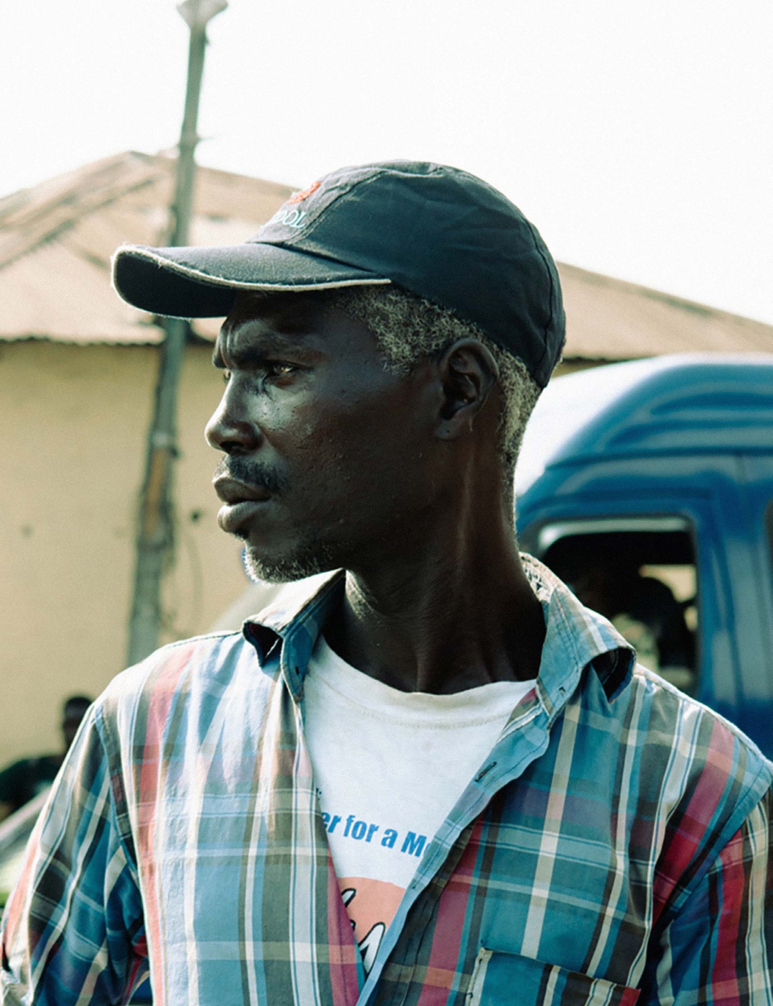 A bus conductor on the streets of Jamestown, Accra