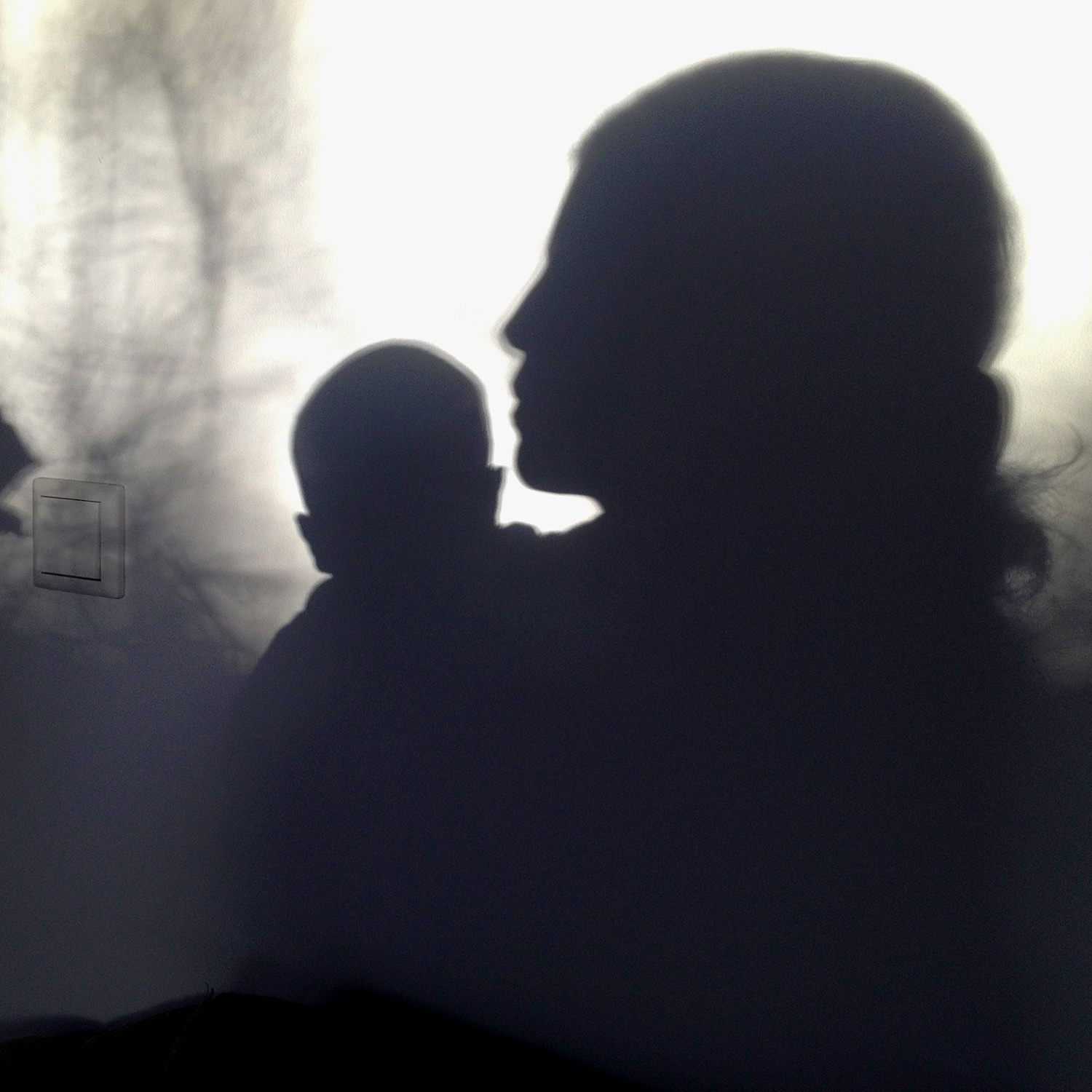 a shadow of a mother and child