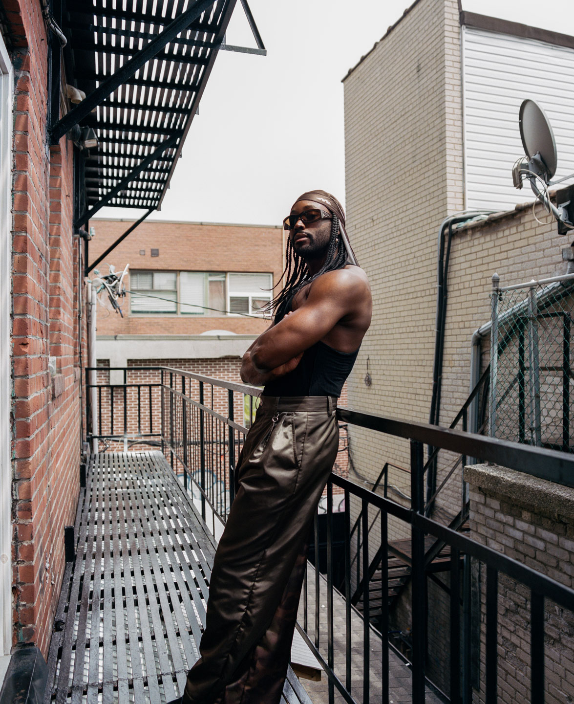 dj Karim Olen Ash on a fire escape in toronto